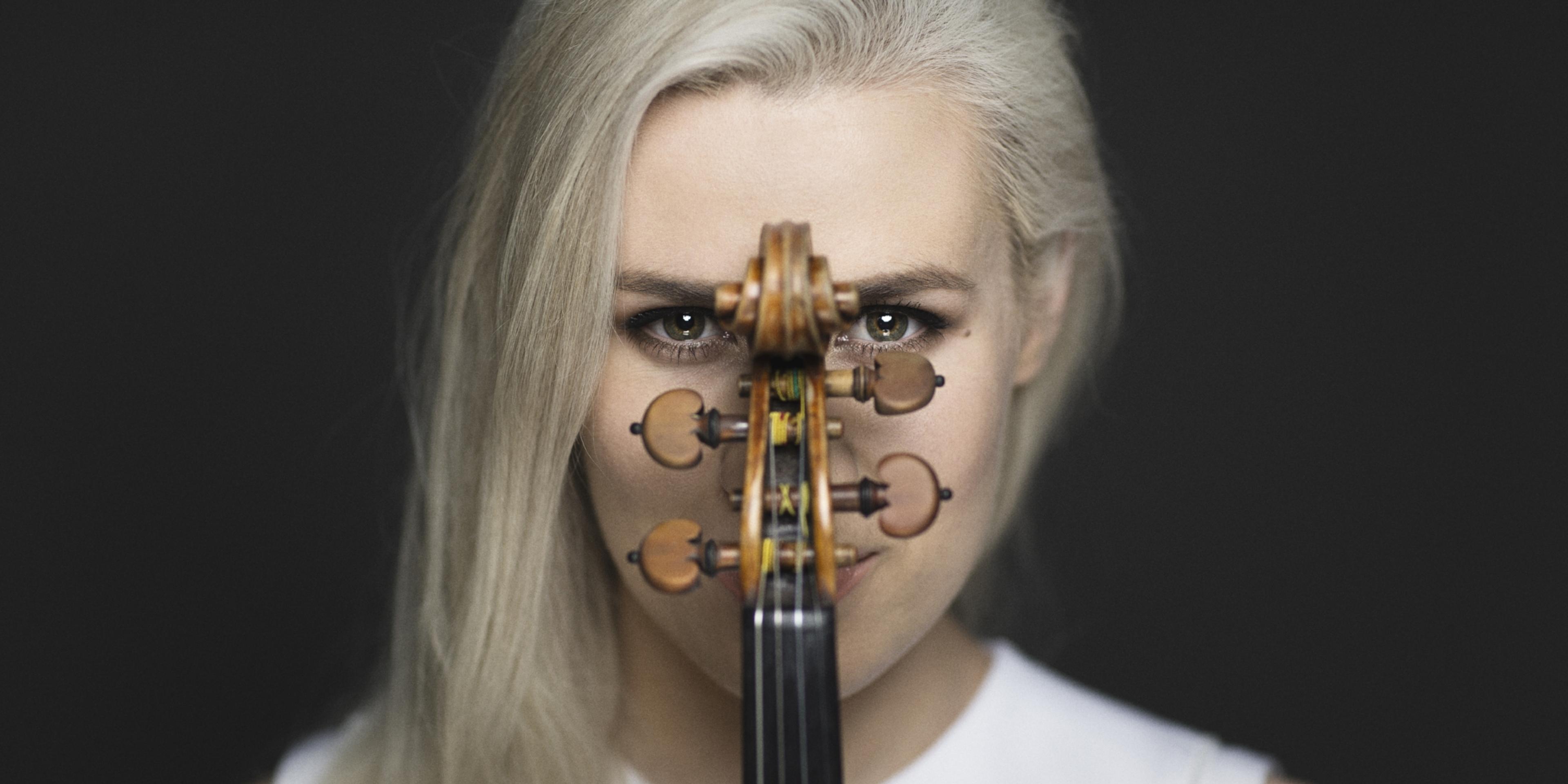 Portrait of the Norwegian violinist Eldbjørg Hemsing with her violin