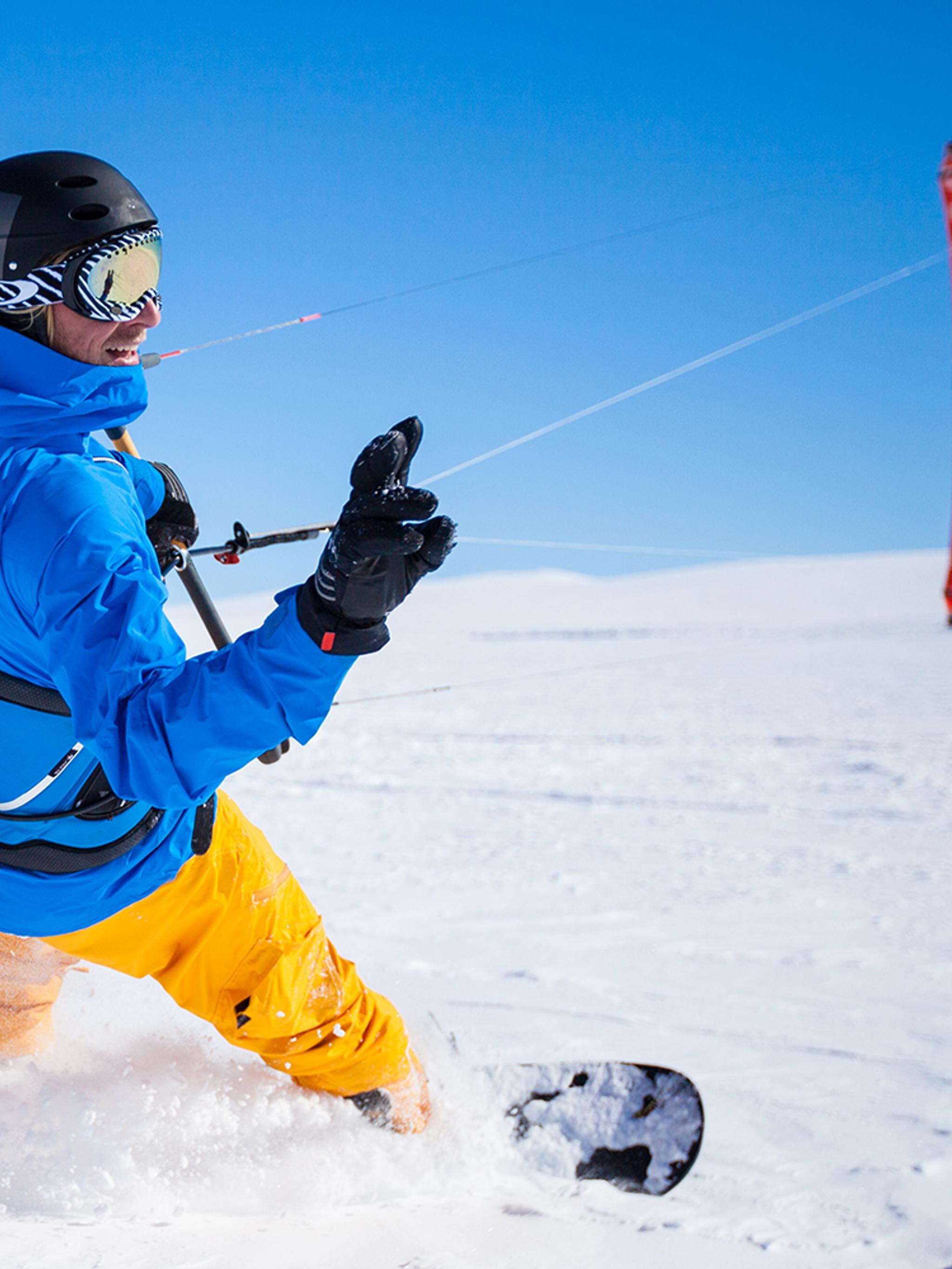 A person snow kiting on the Valdresflye mountain plateau in Valdres, Eastern Norway