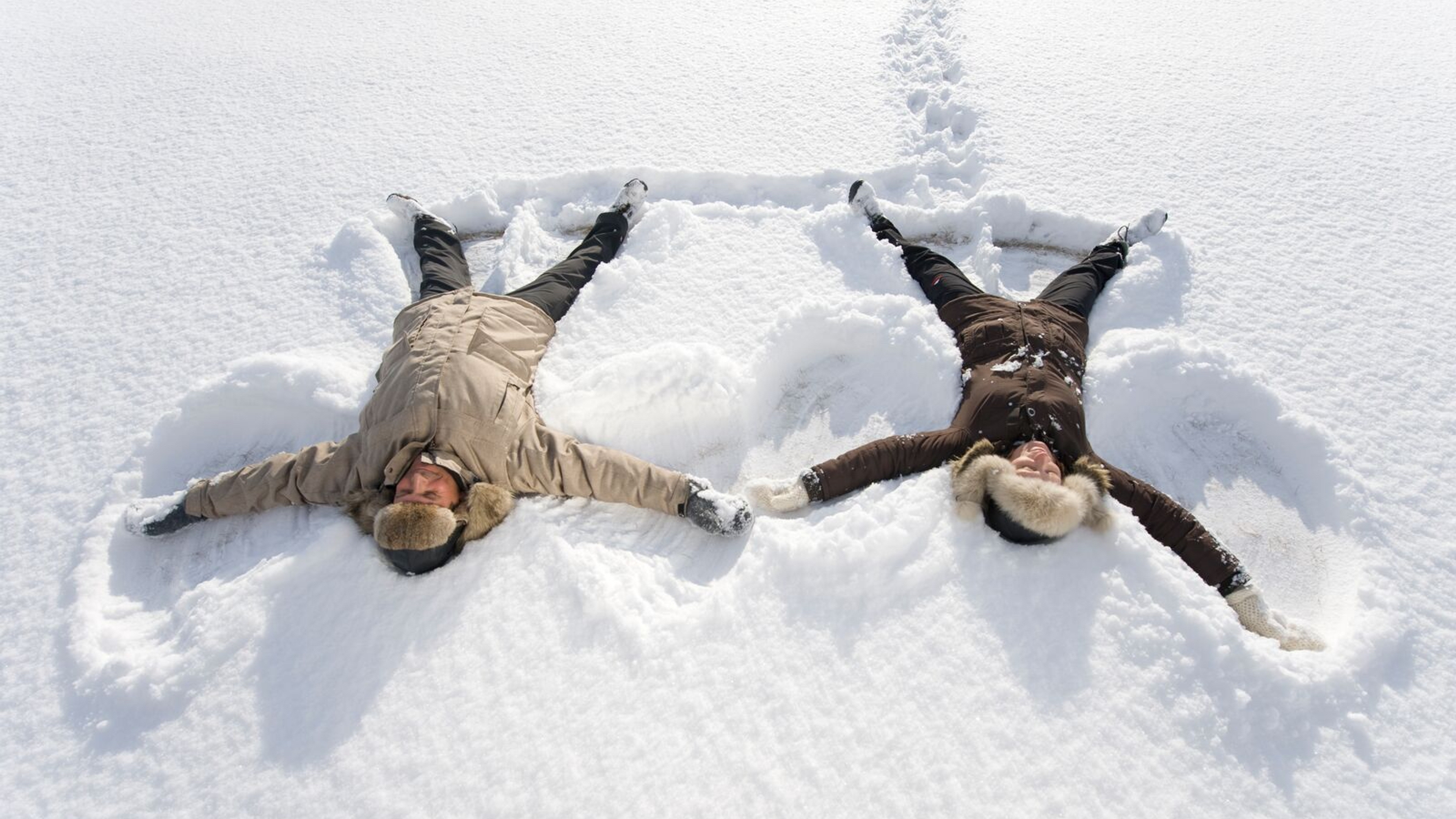 Two people playing in the snow in Finnmark in Northern Norway