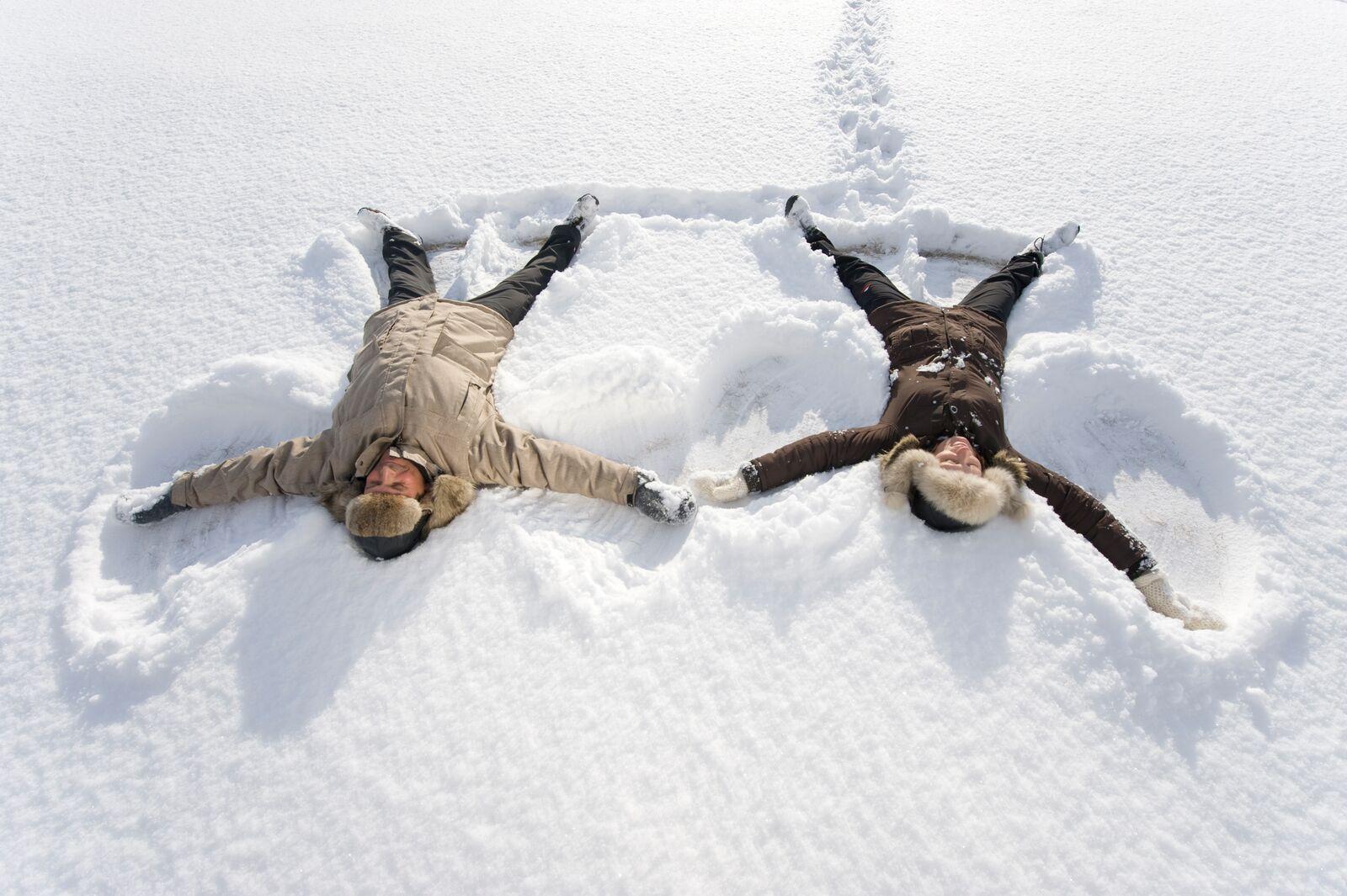 Two people playing in the snow in Finnmark in Northern Norway