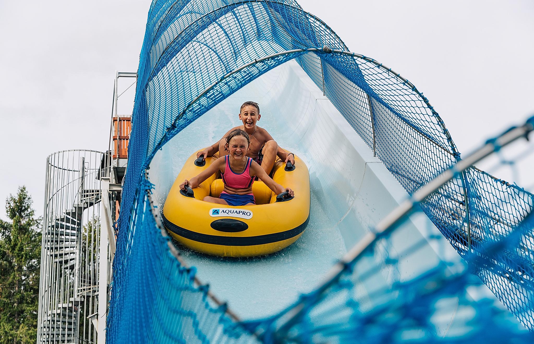 Two children in a water slide at Bø Sommarland waterpark in Telemark, Eastern Norway