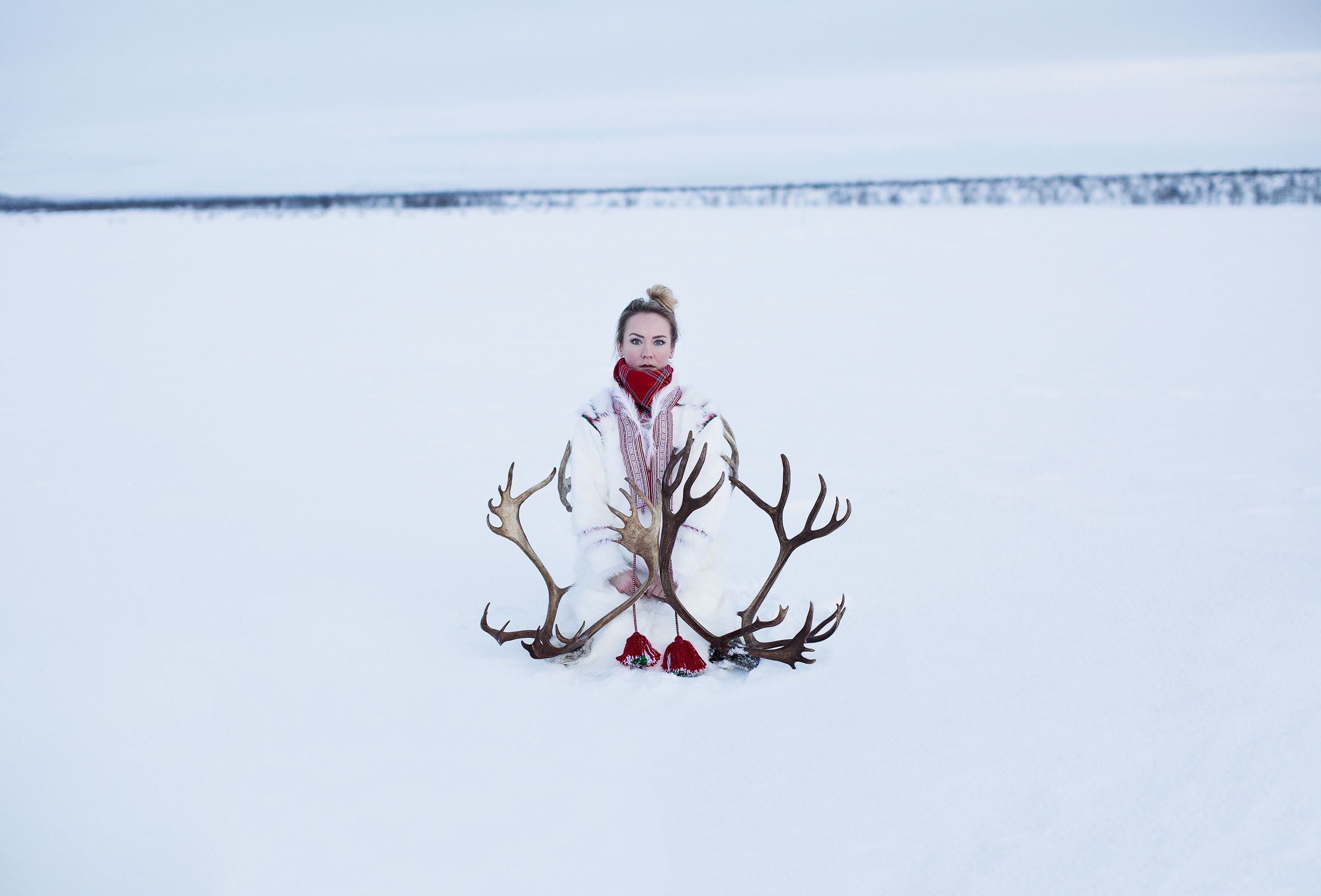 Elle Márjá Eira out in the snow with reindeer antlers in Finnmark, Northern Norway