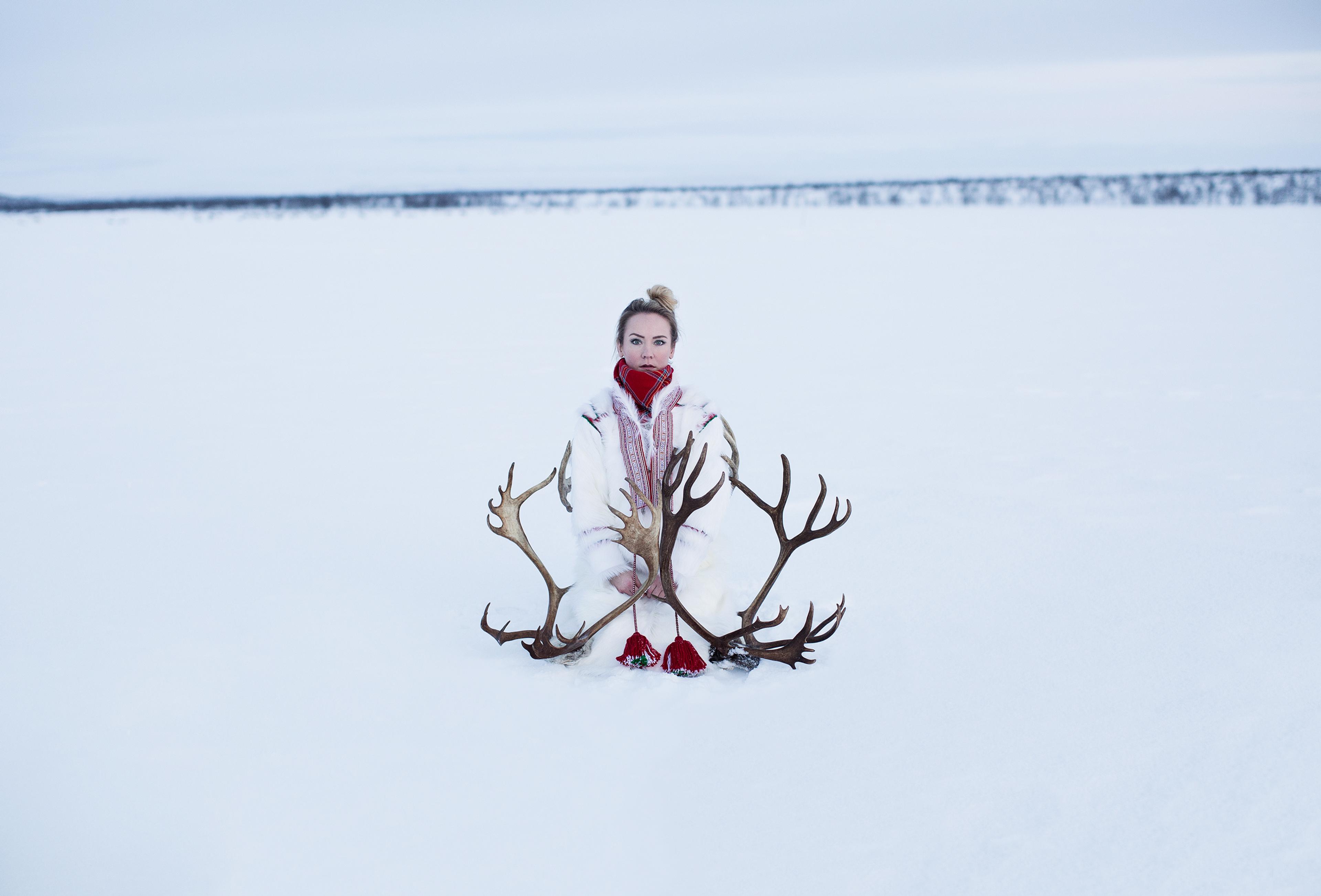 Elle Márjá Eira out in the snow with reindeer antlers in Finnmark, Northern Norway