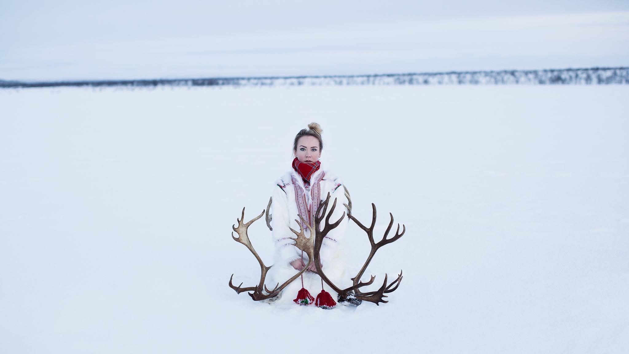 Elle Márjá Eira out in the snow with reindeer antlers in Finnmark, Northern Norway