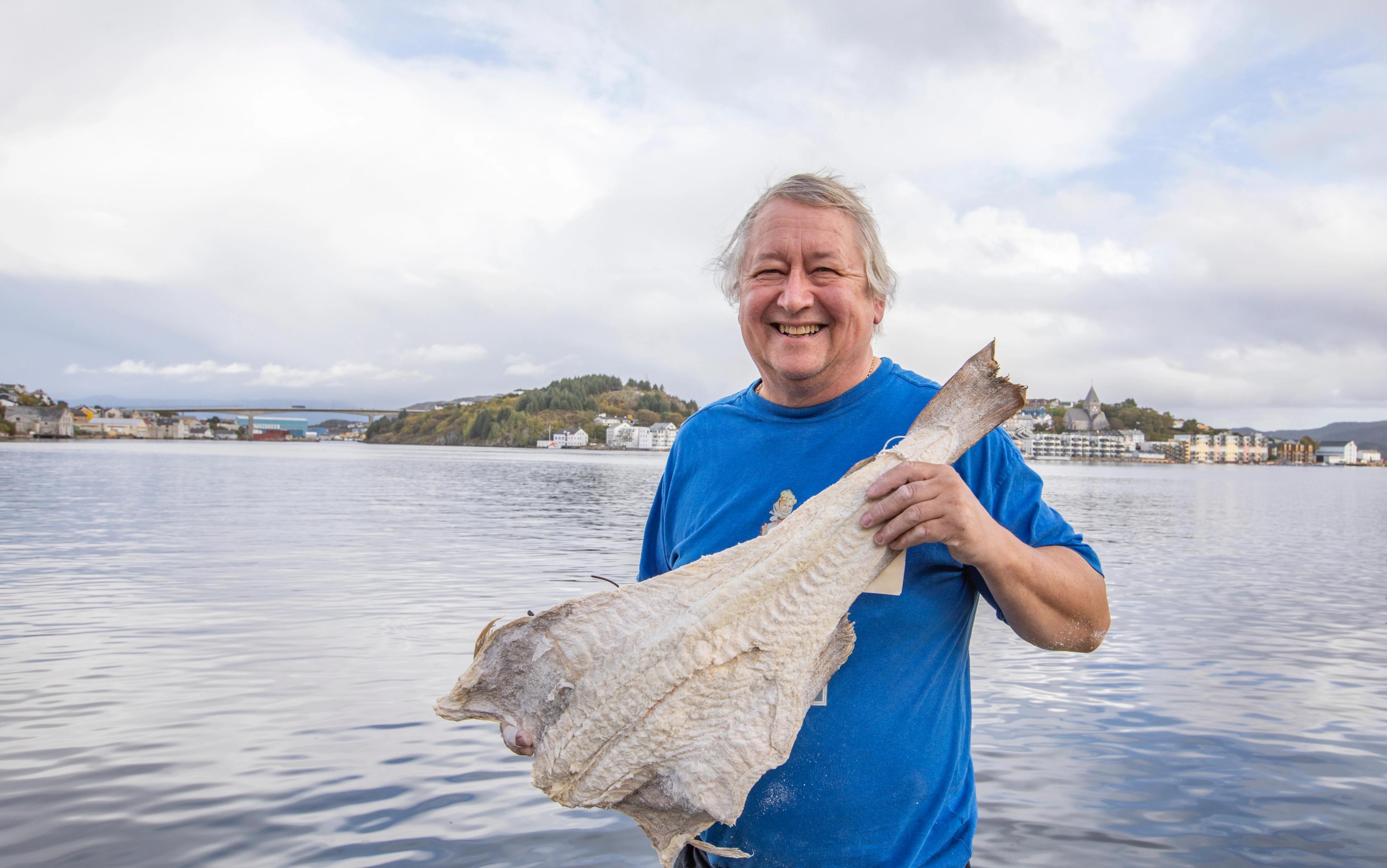 Man showing clip fish in Kristiansund