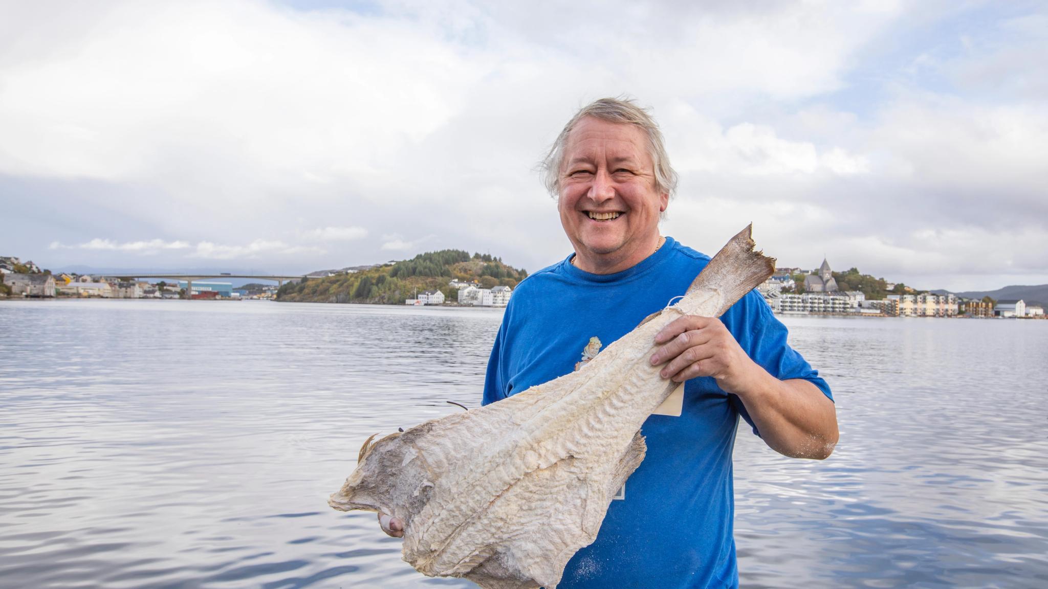 Man showing clip fish in Kristiansund