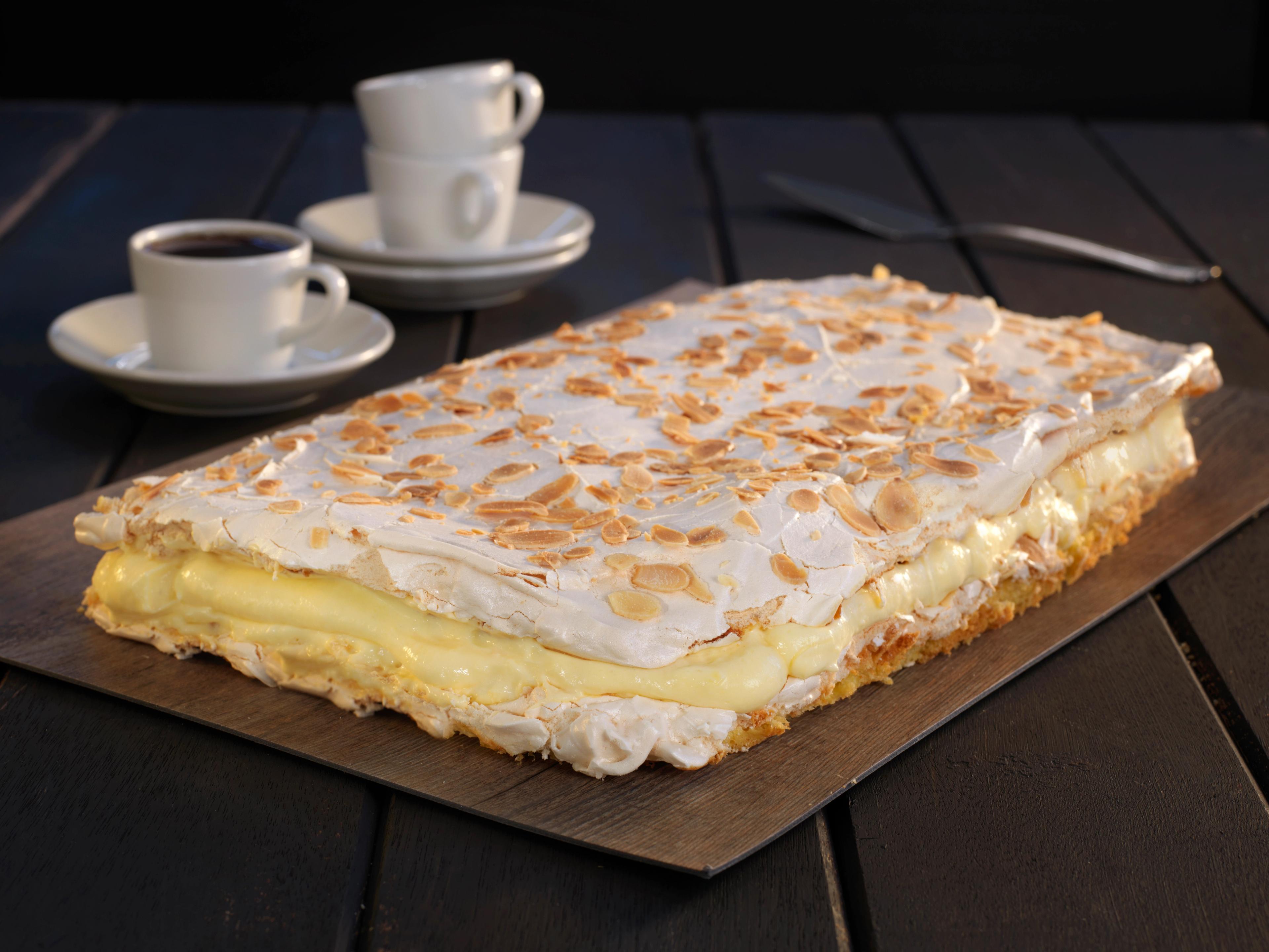 A classic Kvæfjordkake made of merengue and vanilla cream