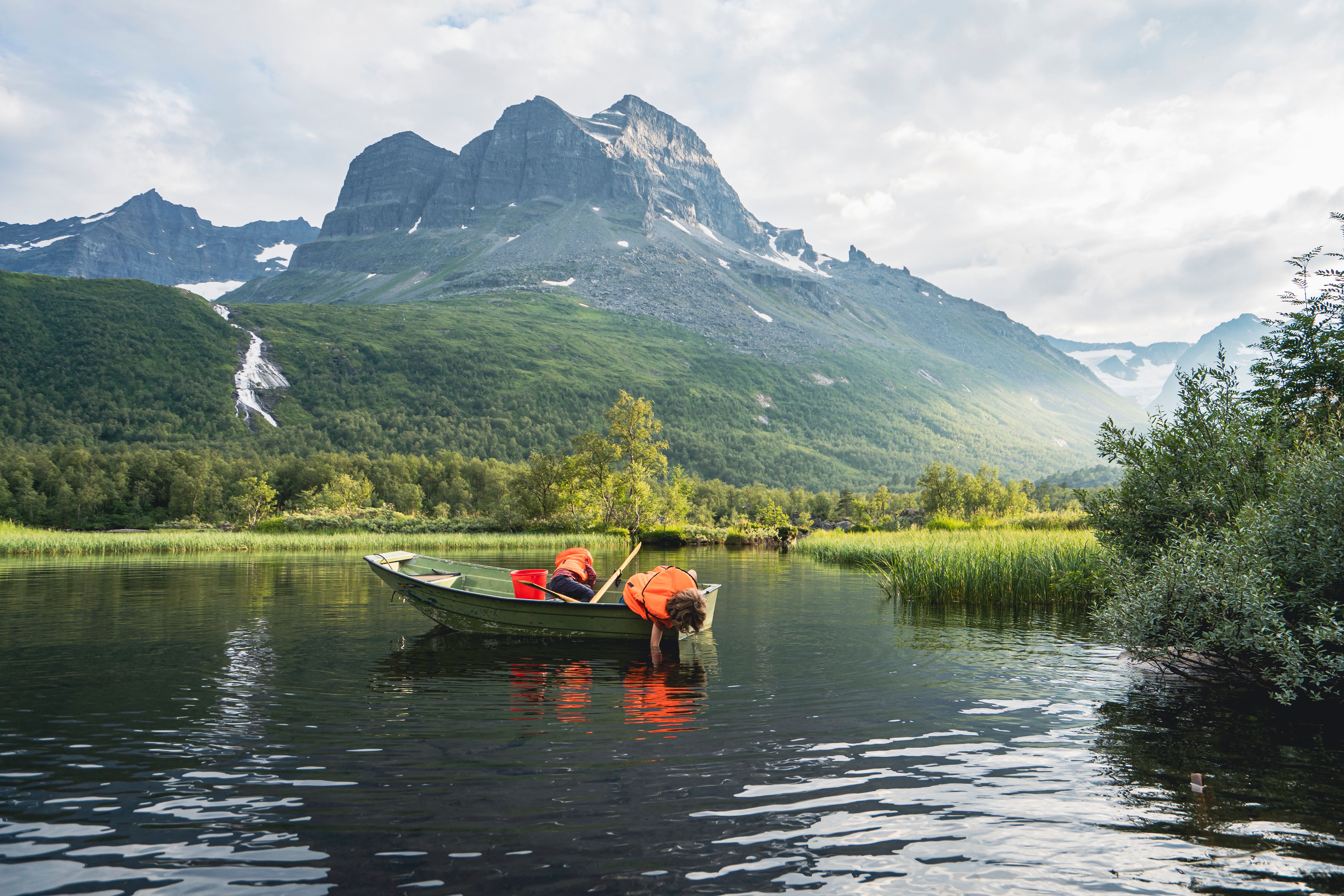 Two kids in a boat in the Innerdalen area.