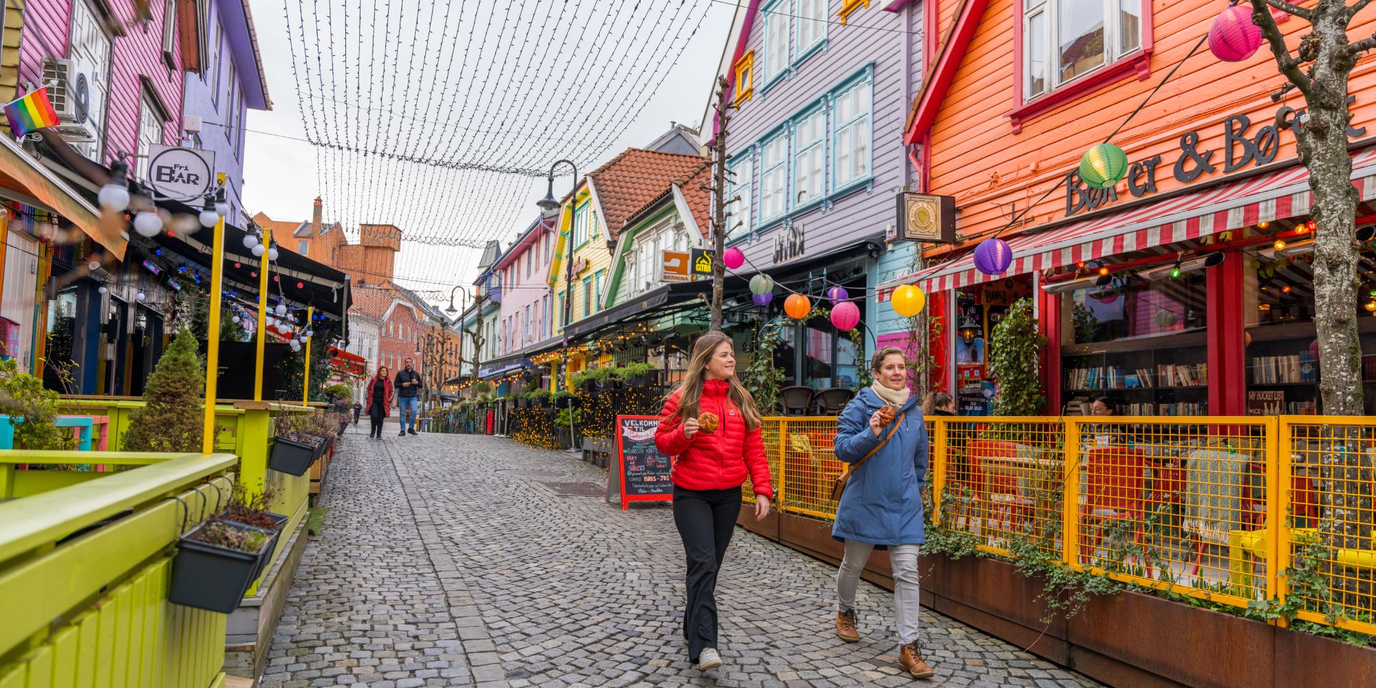 Two friends walking in Fargegaten, The colour street, in Stavanger