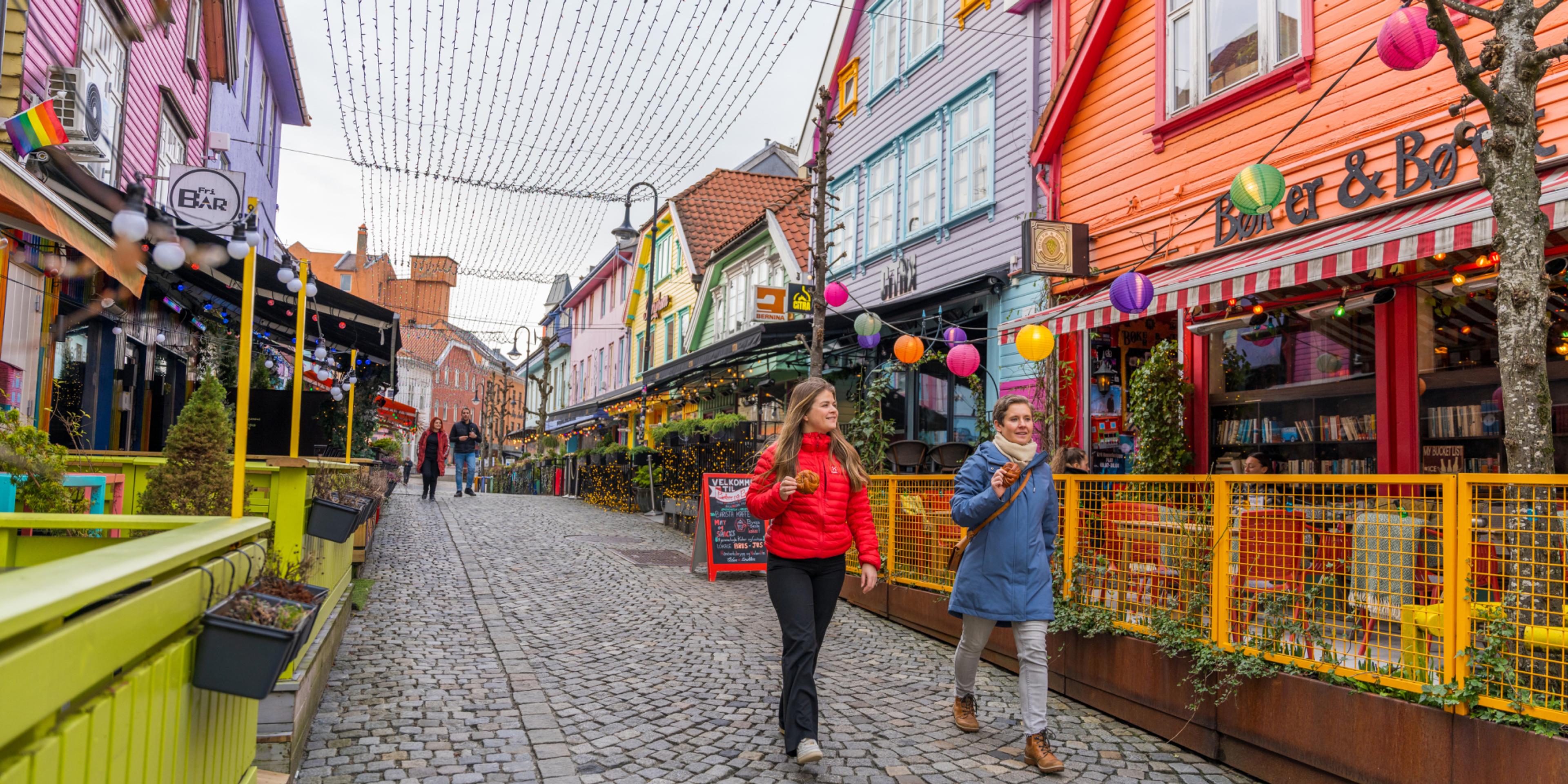 Two friends walking in Fargegaten, The colour street, in Stavanger