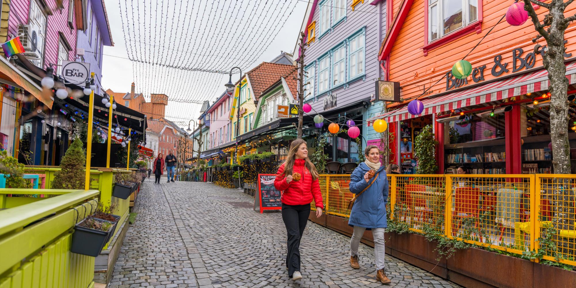 Two friends walking in Fargegaten, The colour street, in Stavanger