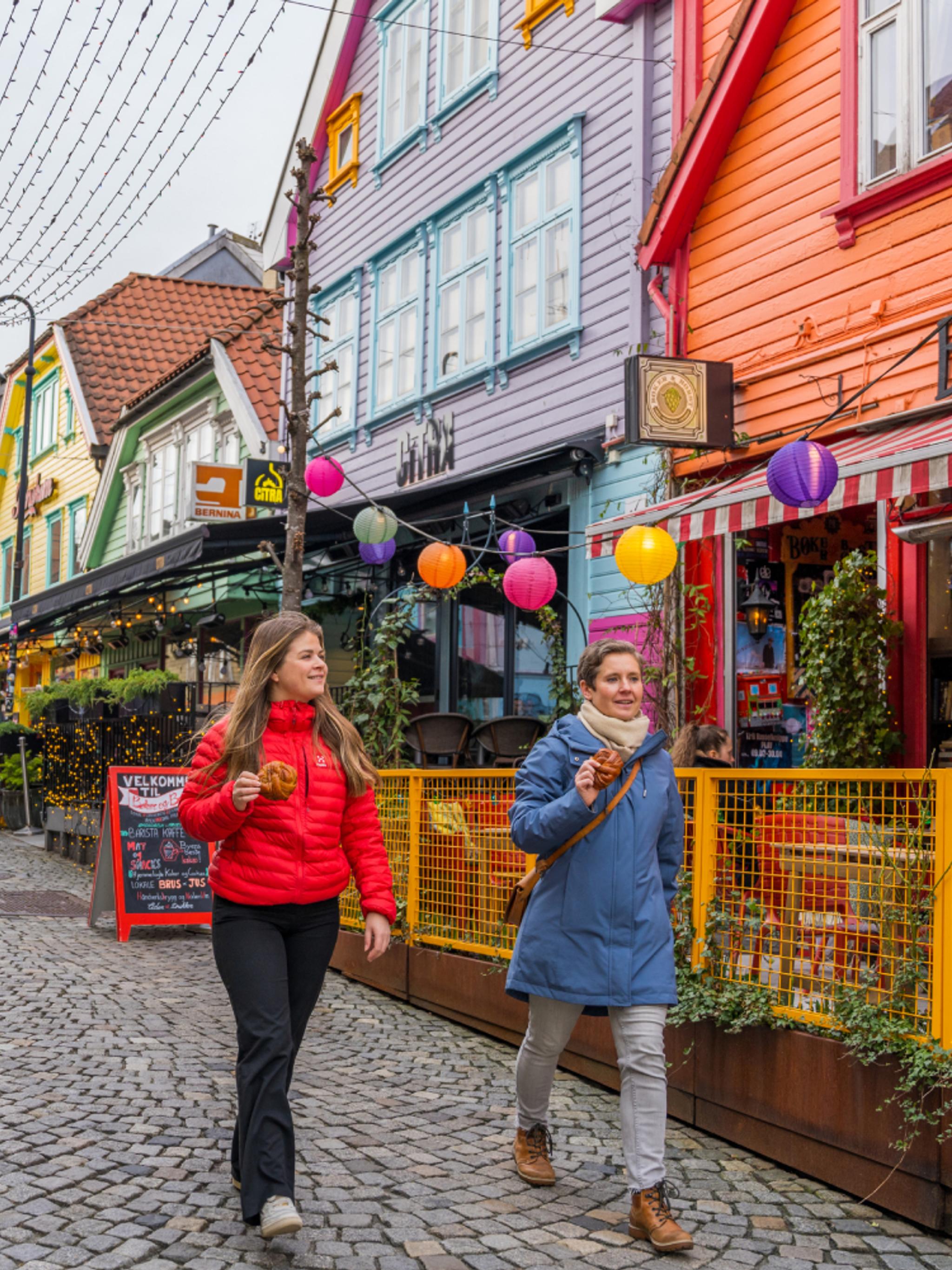 Two friends walking in Fargegaten, The colour street, in Stavanger