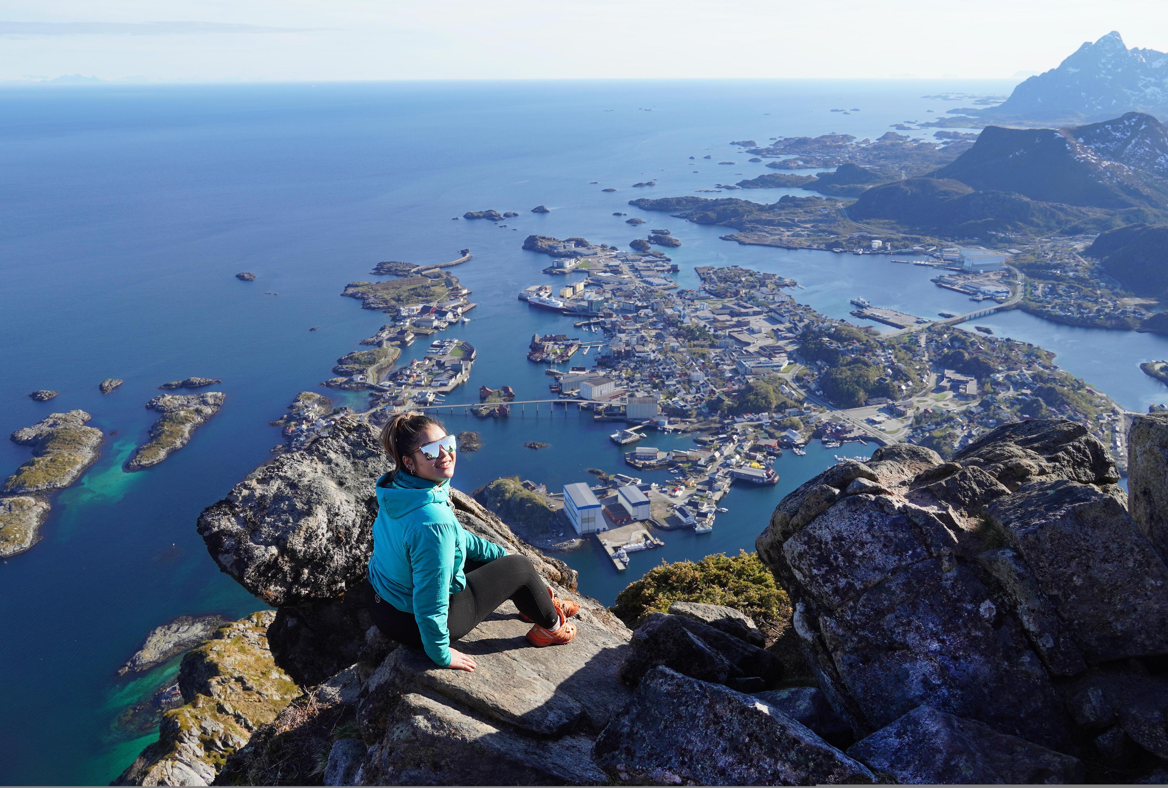 Woman on the top of a mountain