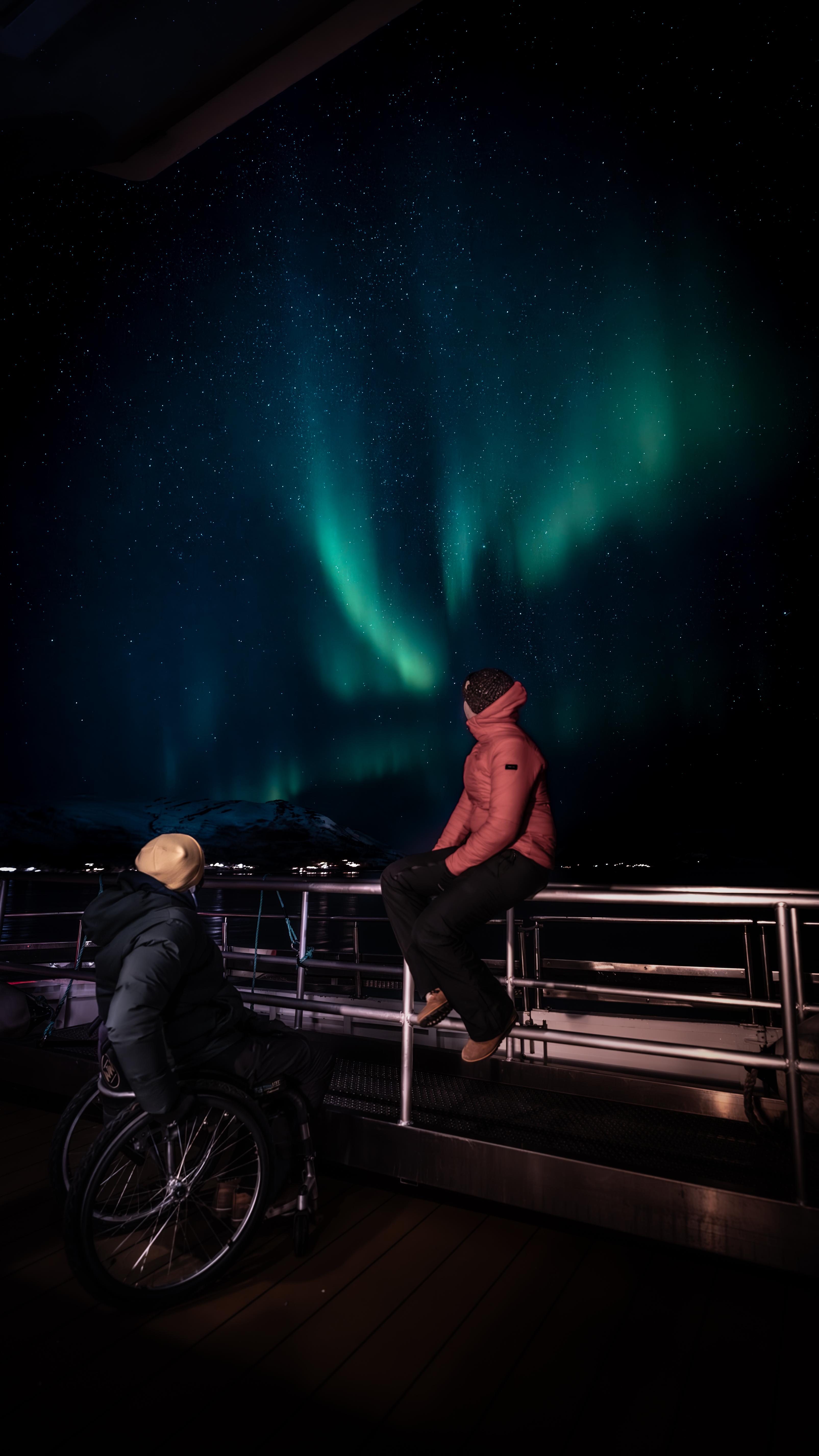 Myriam and Pierre Cabon under the northern lights in Tromsø, Nortern Norway