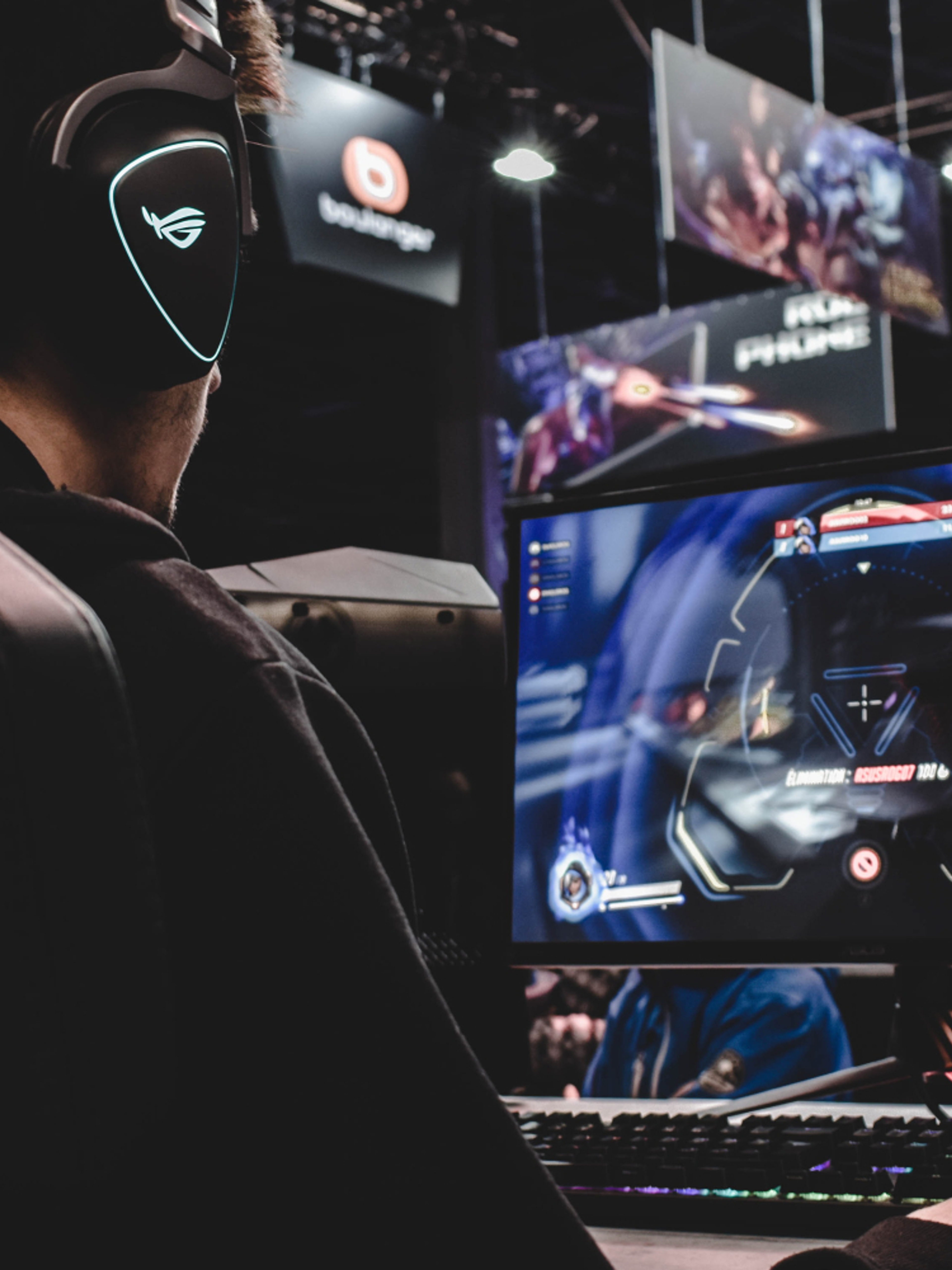 A man playing the game Overwatch on a computer