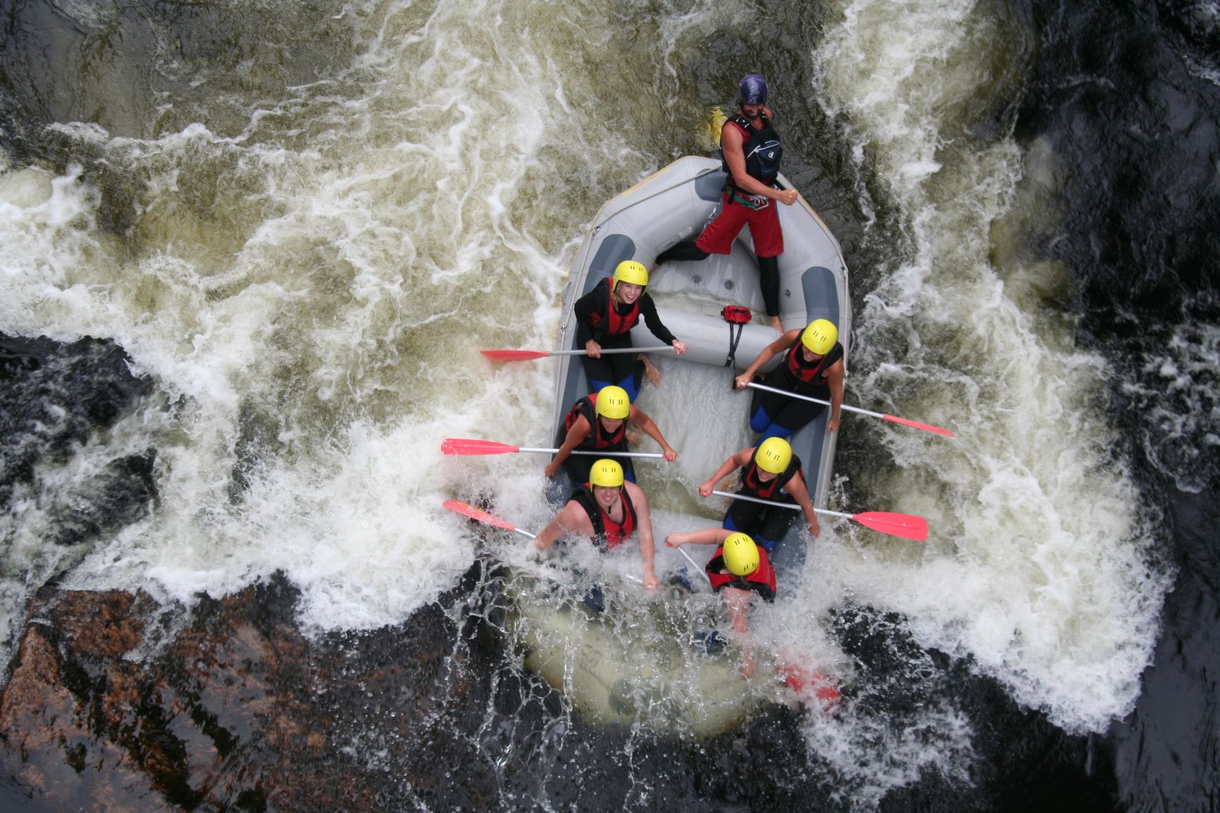 A group of people rafting in the Mandalselva river in Mandal, Southern Norway