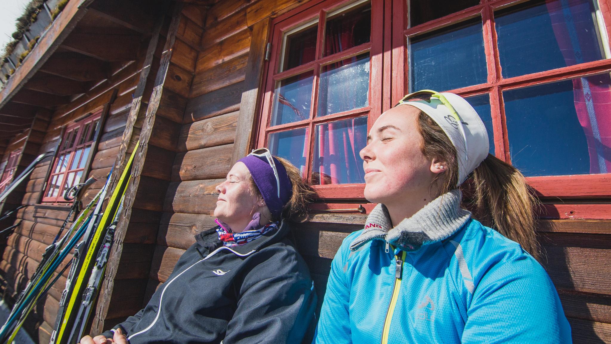 Two woman tanning at the cabin