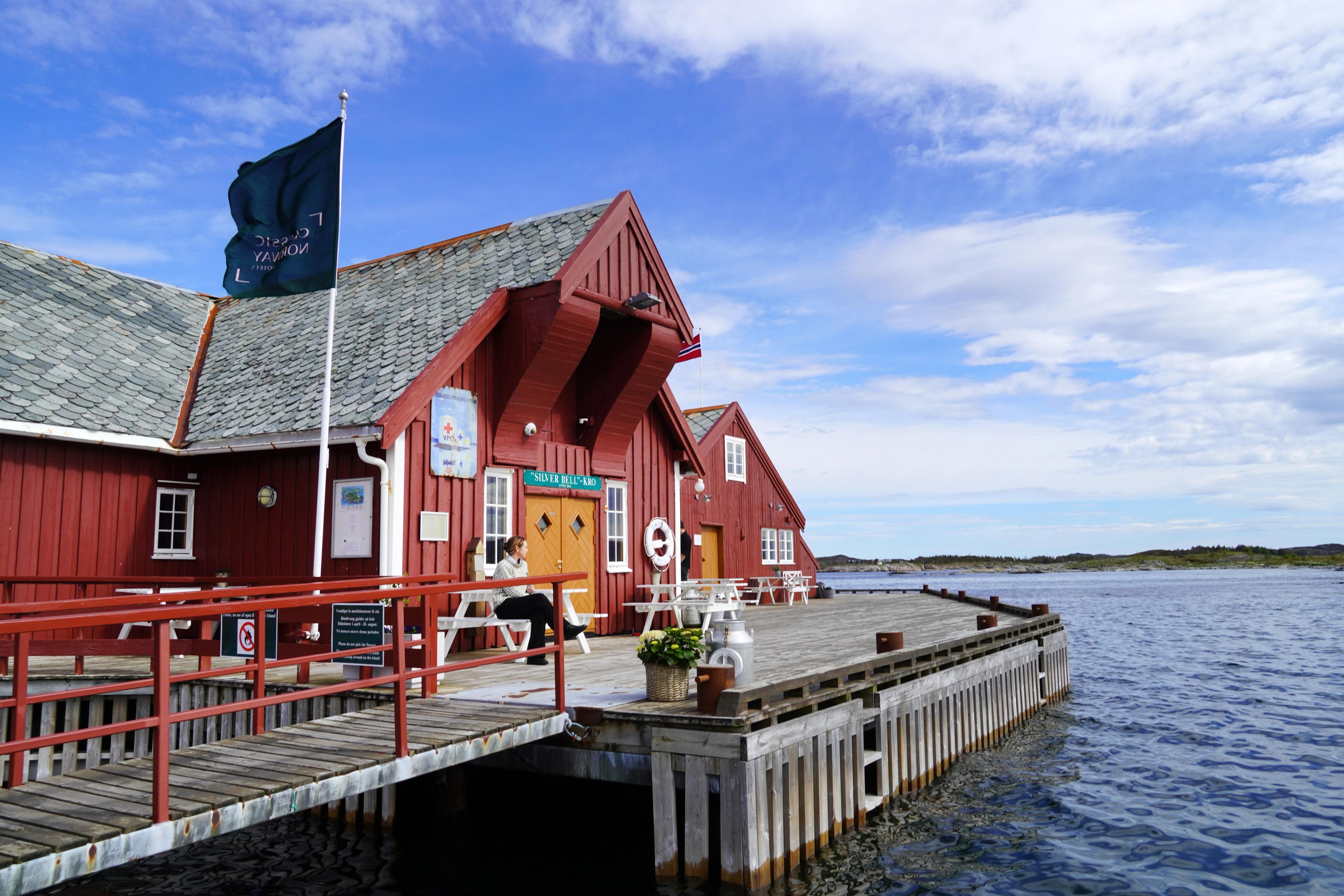Håholmen Havstuer - a red wooden hotel on an island by the sea