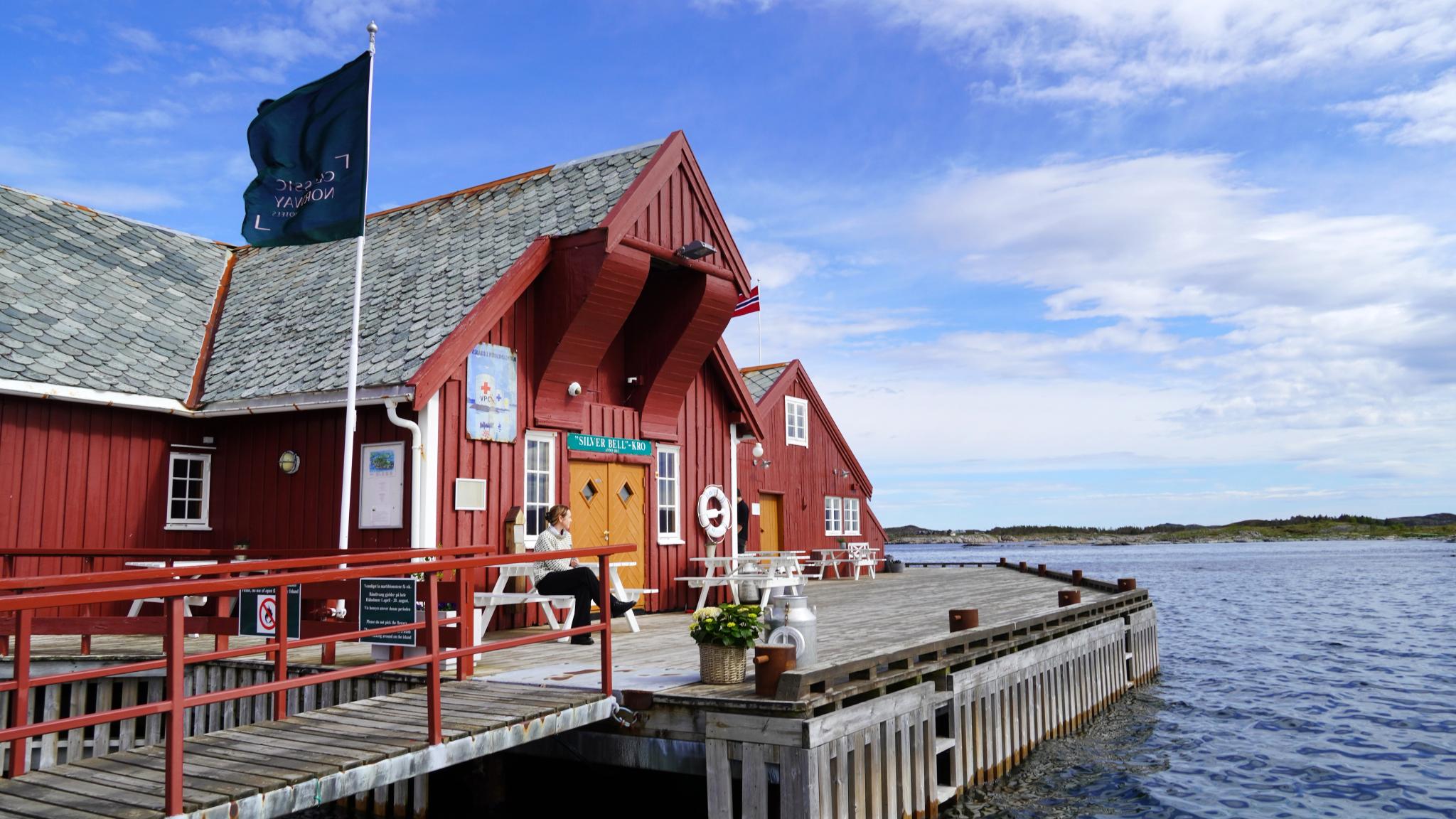Håholmen Havstuer - a red wooden hotel on an island by the sea