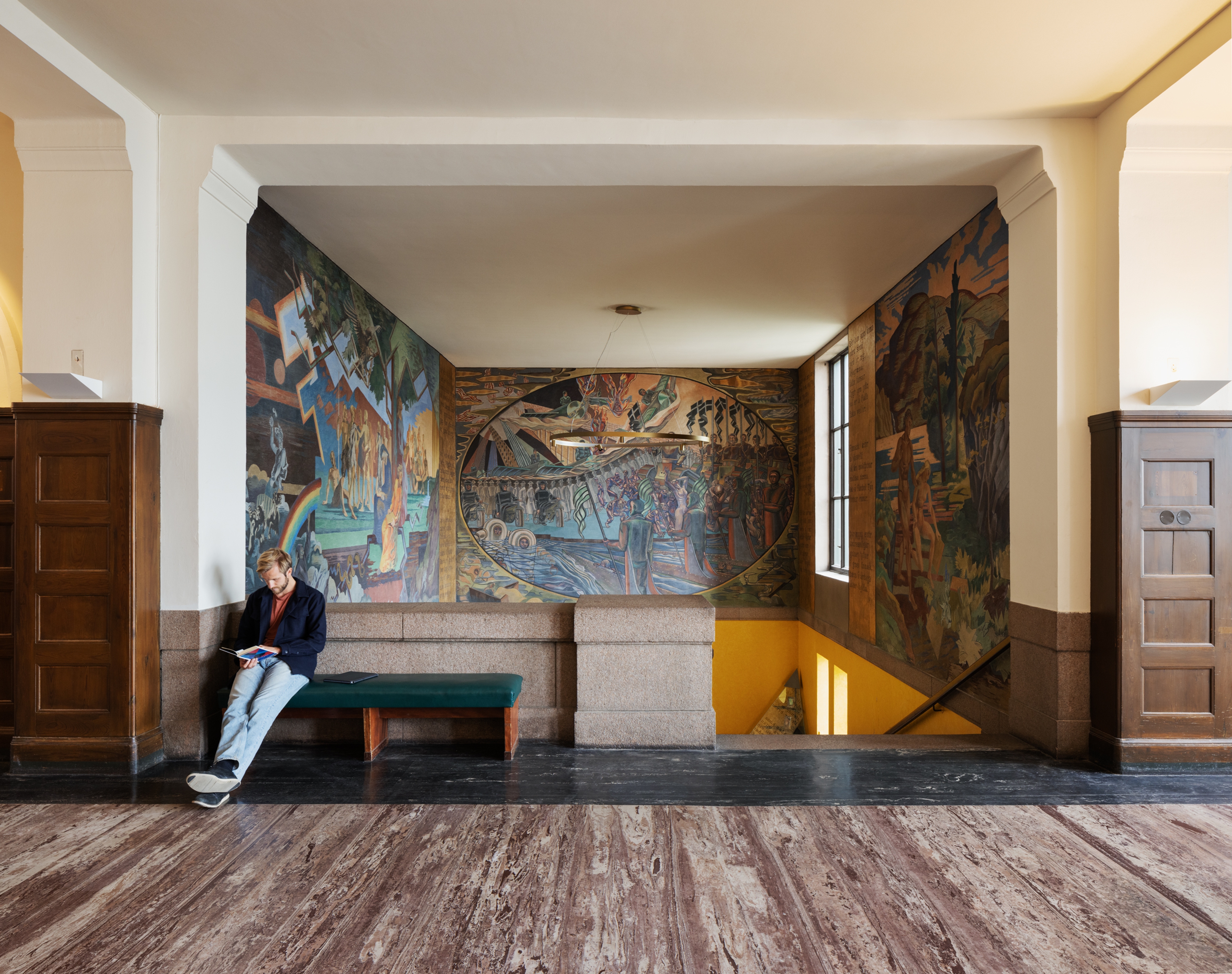 a man sitting in the hall in the National Library.