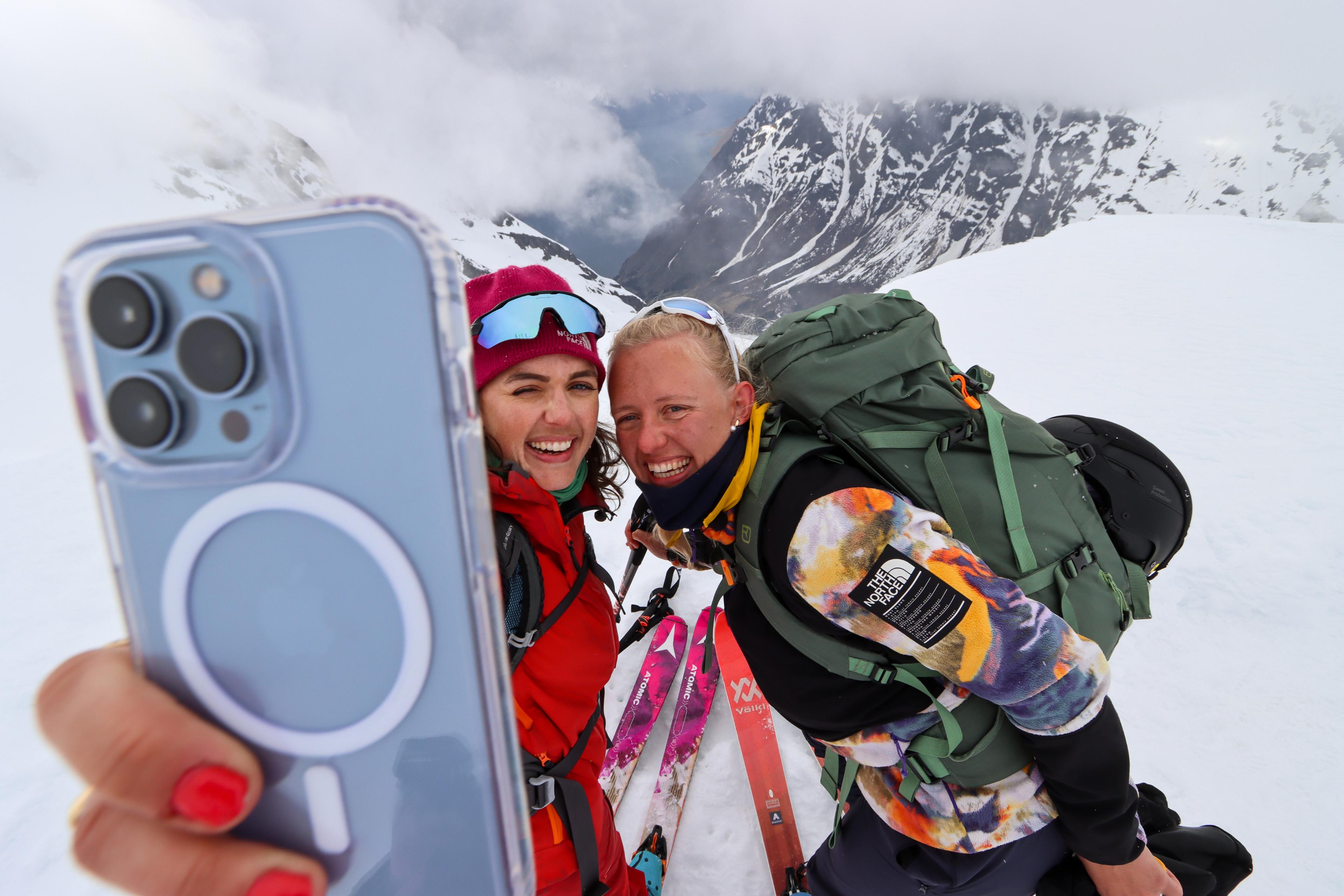 Two people taking a selfie on a ski tour at Sunnmøre, Fjord Norway.