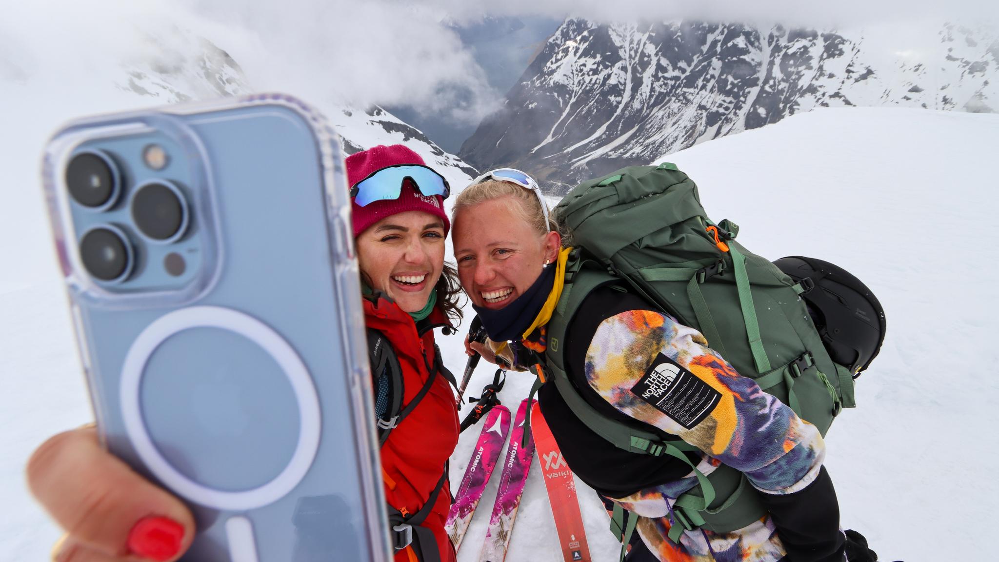 Two people taking a selfie on a ski tour at Sunnmøre, Fjord Norway.