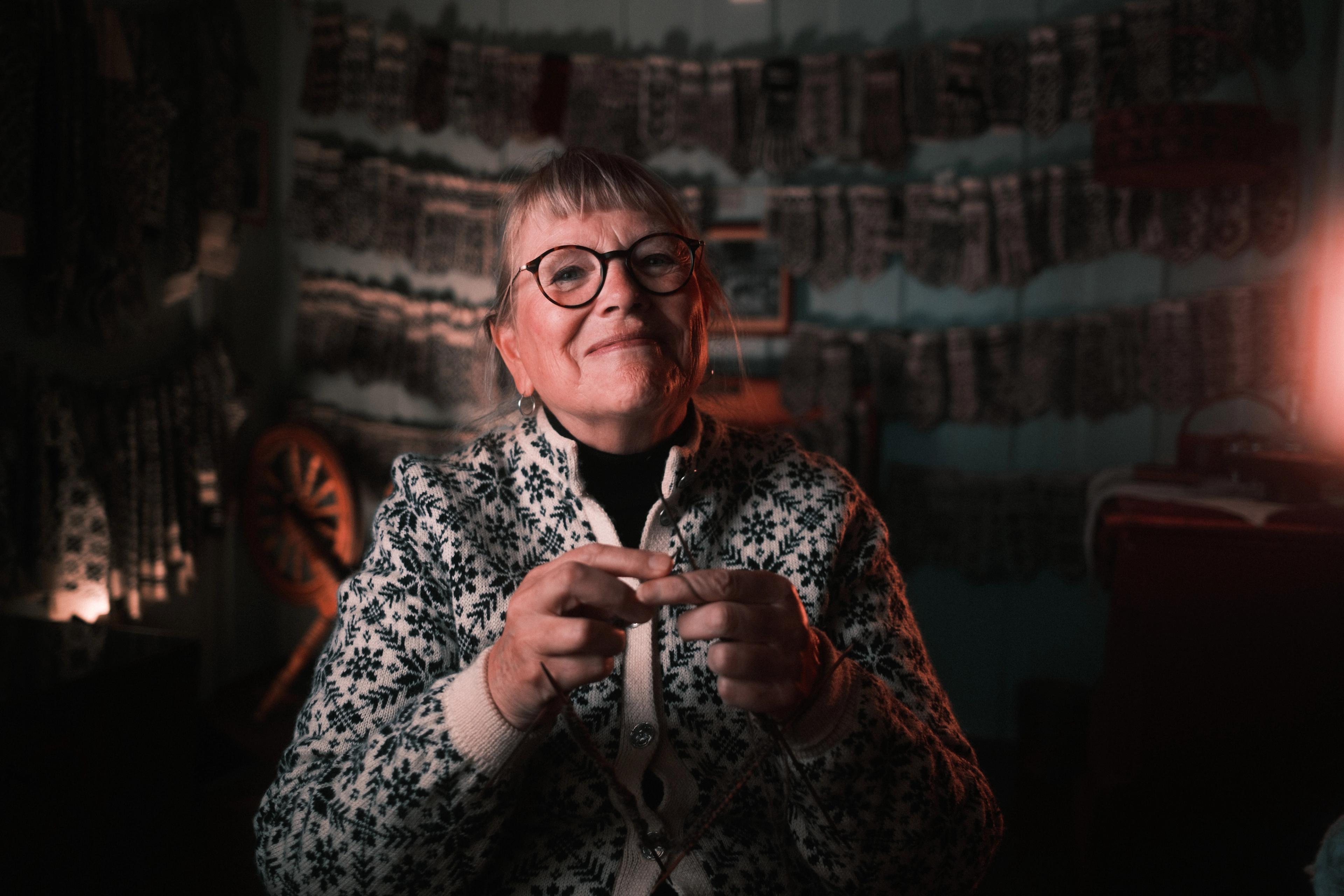 Woman knitting Selbu mittens, Trøndelag, Norway.