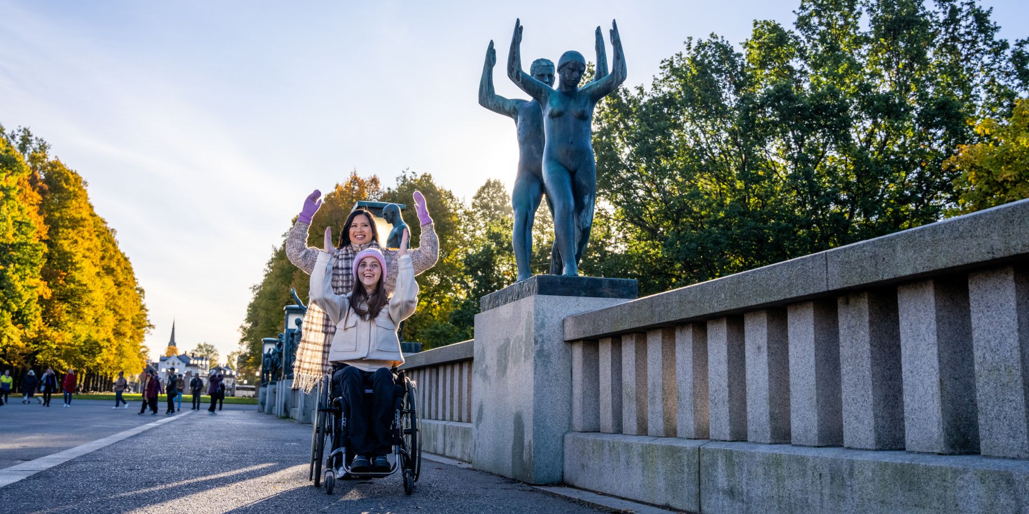 Two women imitating a statue in Vigelandsparken at Frogner in Oslo, Eastern Norway
