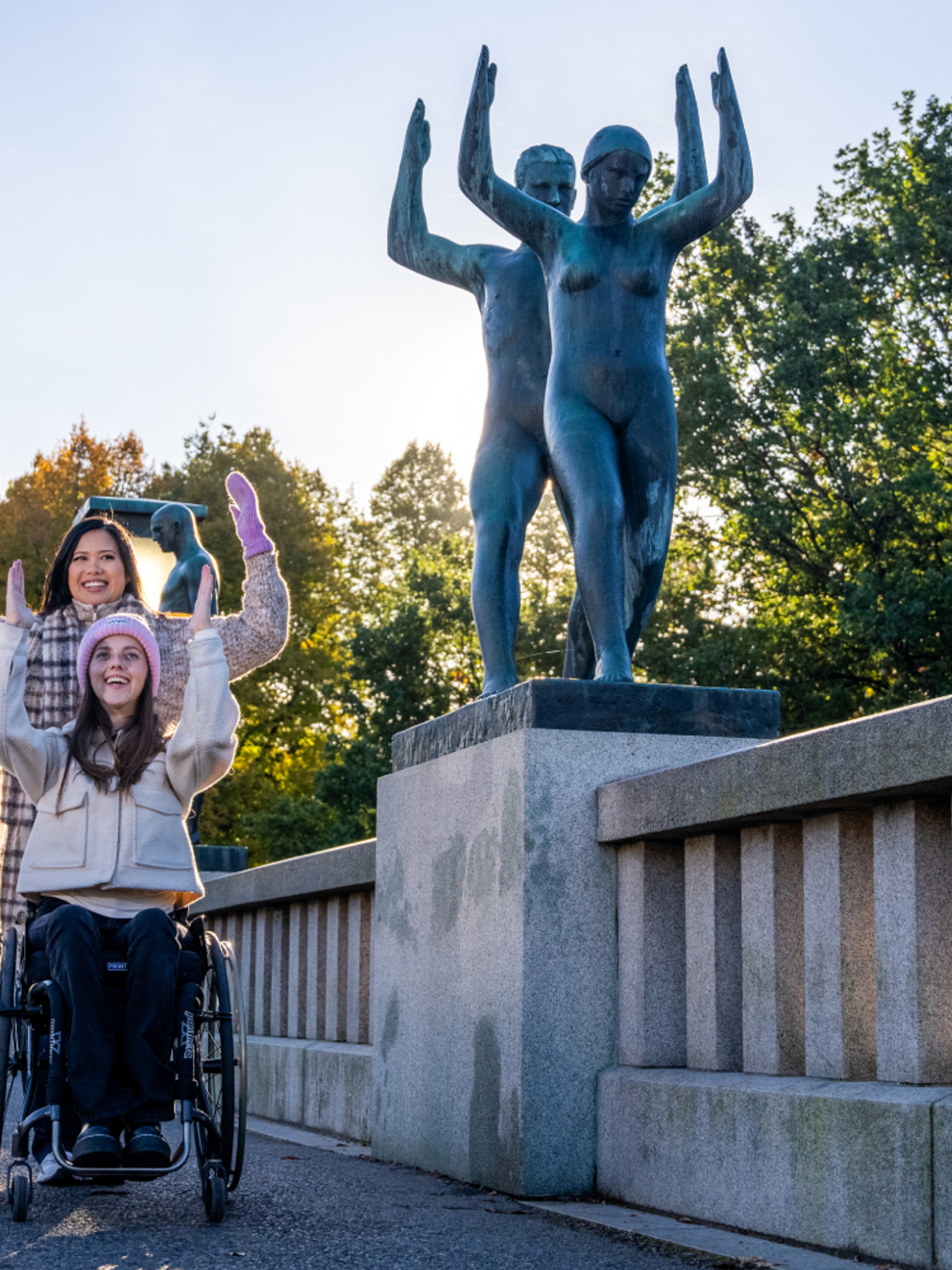 Two women imitating a statue in Vigelandsparken at Frogner in Oslo, Eastern Norway