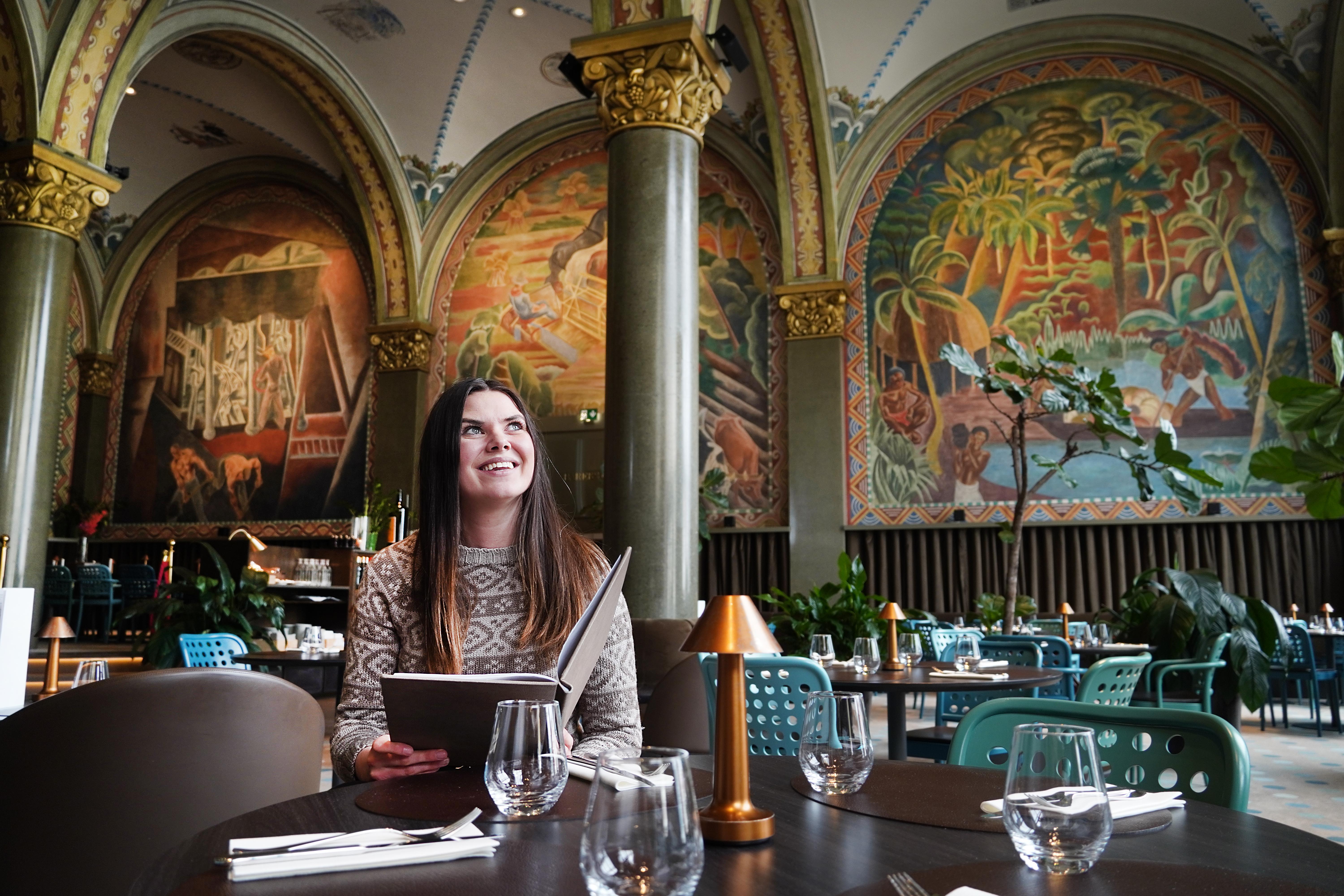 Woman sitting in Frescohallen Restaurant - Bergen Børs Hotel