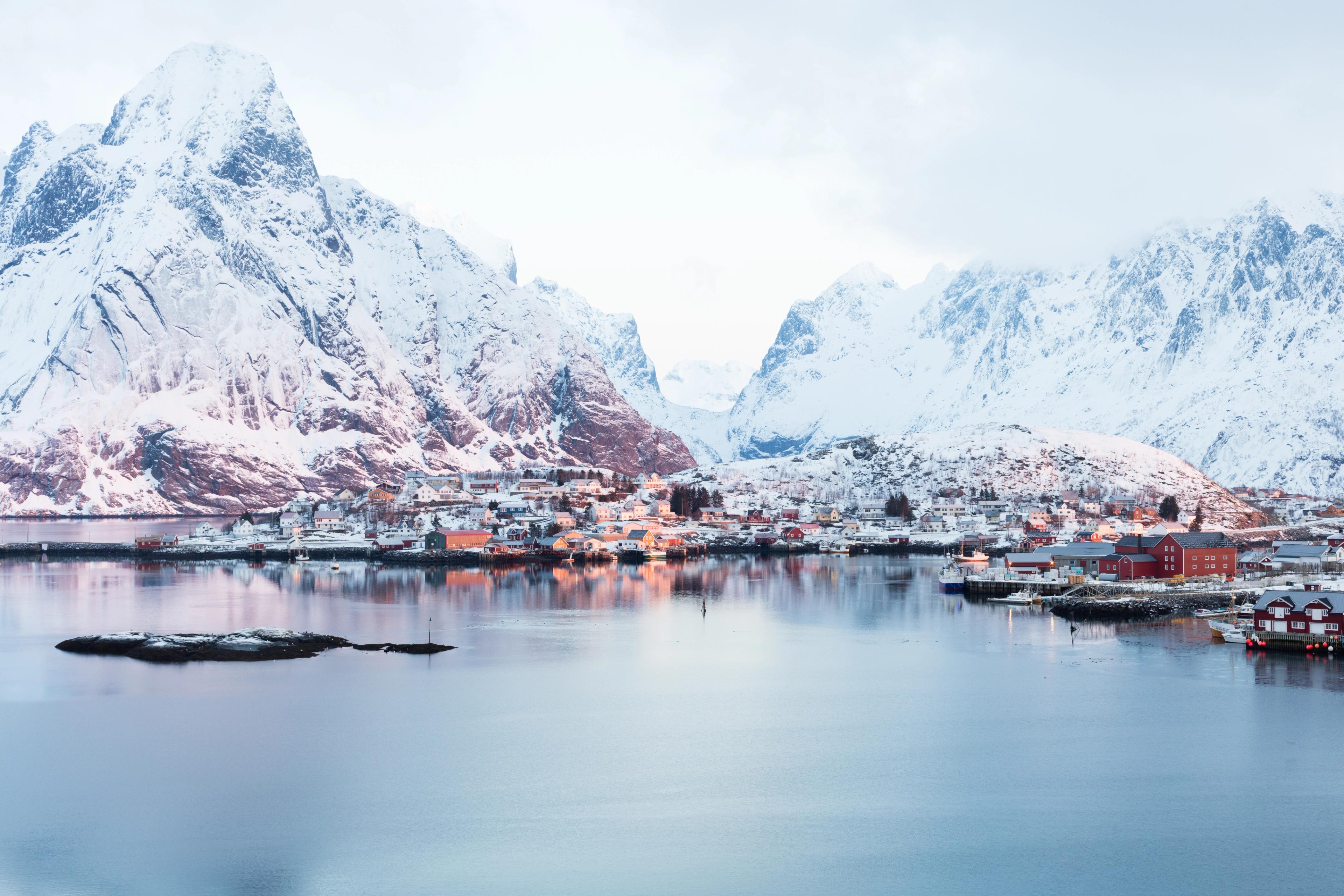 Snowy mountains and a fishing village in Northern Norway.
