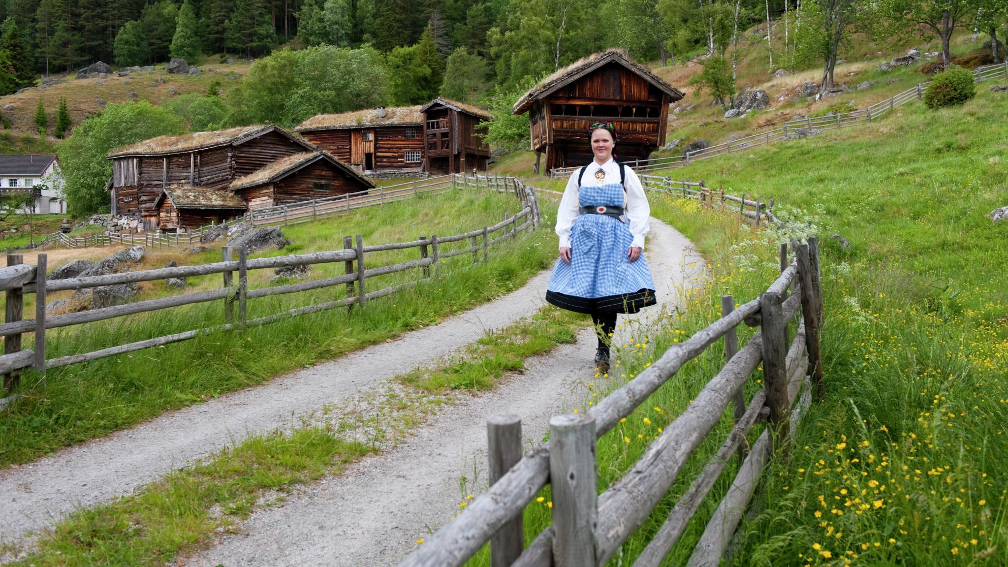 Woman in bunad at Rygnestadtunet, Telemark