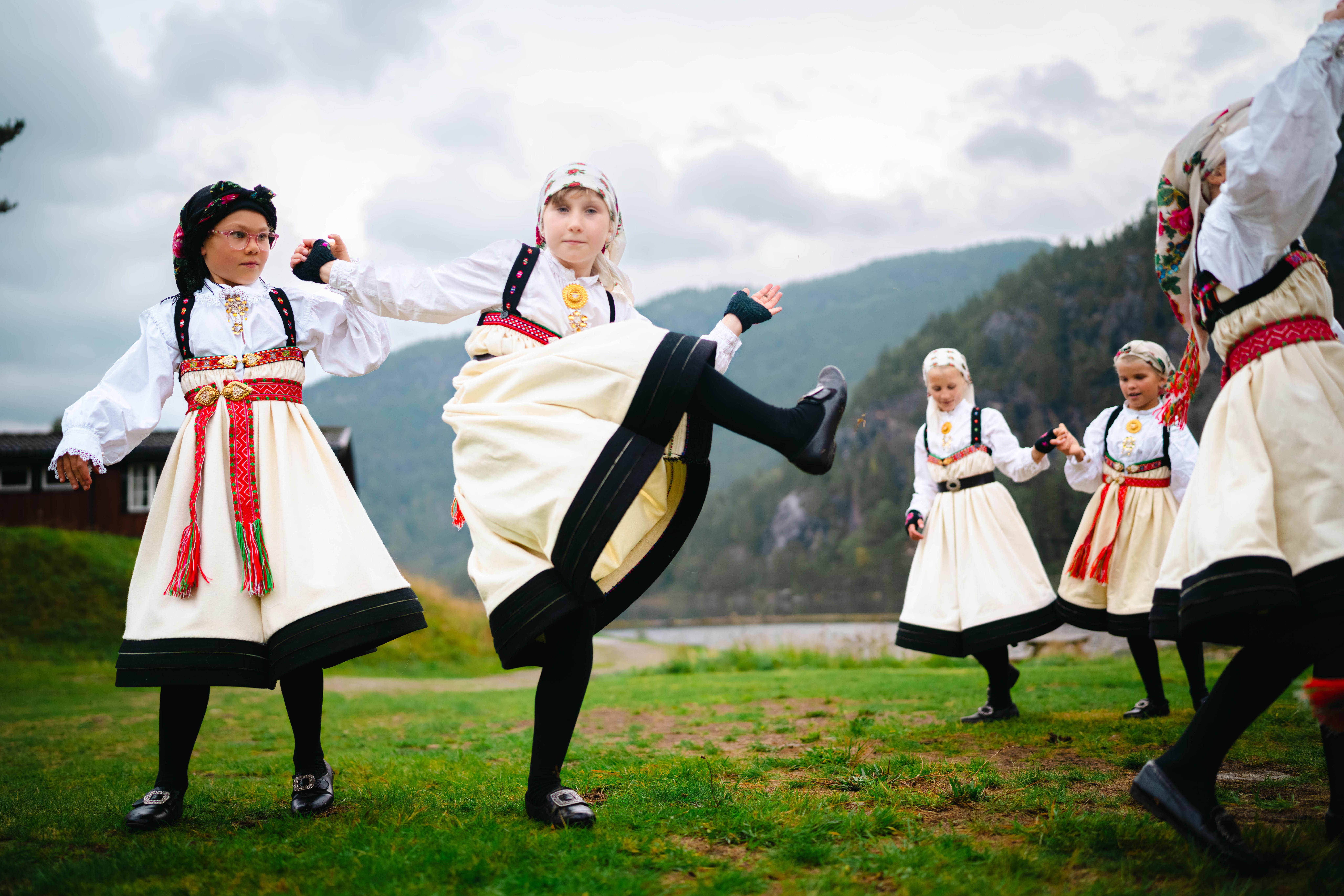 A group of young girls dancing "Setesdalsgangar", a traditional Norwegian folk dance from the Setesdal valley in Southern Norway.