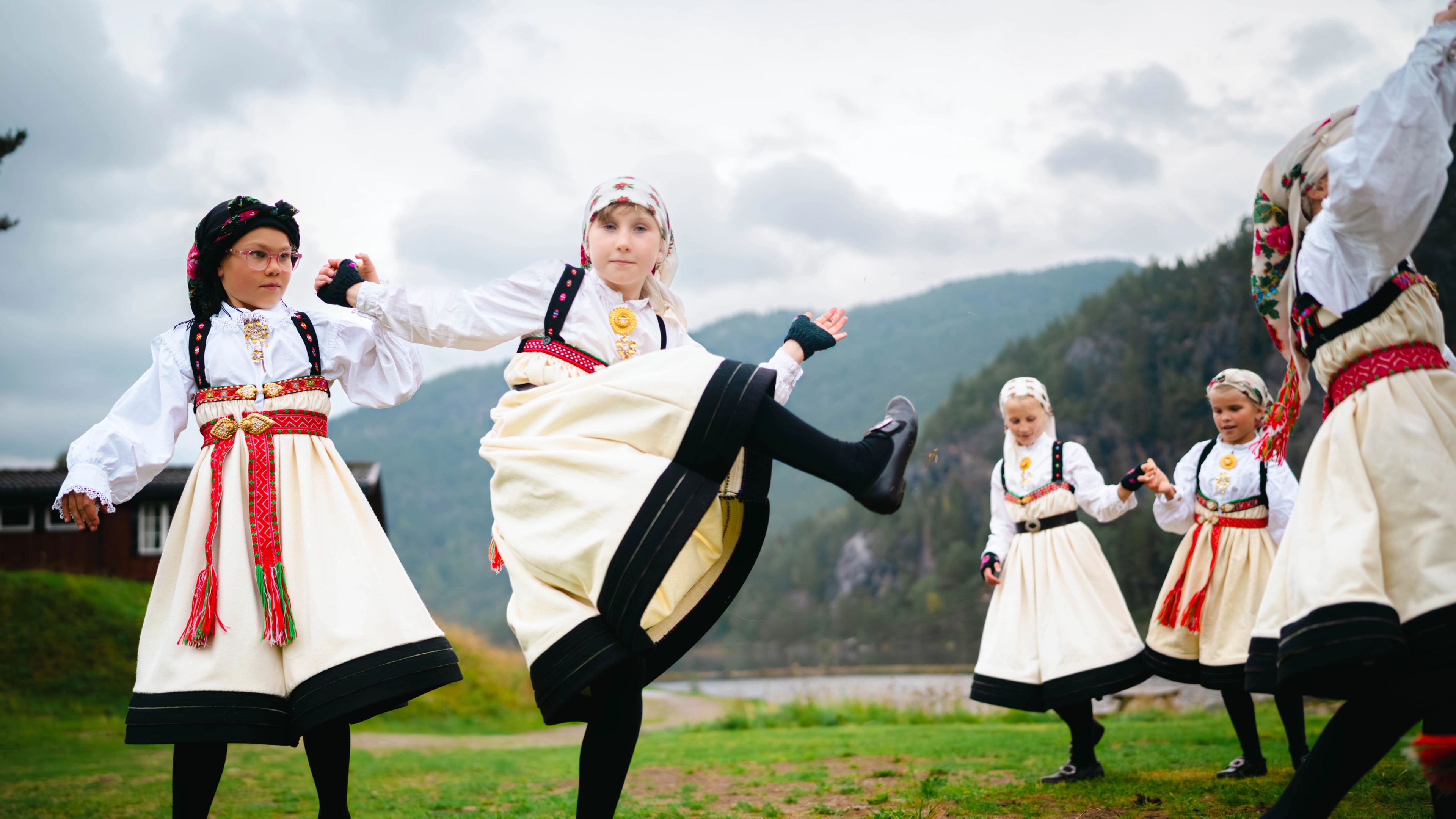 A group of young girls dancing "Setesdalsgangar", a traditional Norwegian folk dance from the Setesdal valley in Southern Norway.