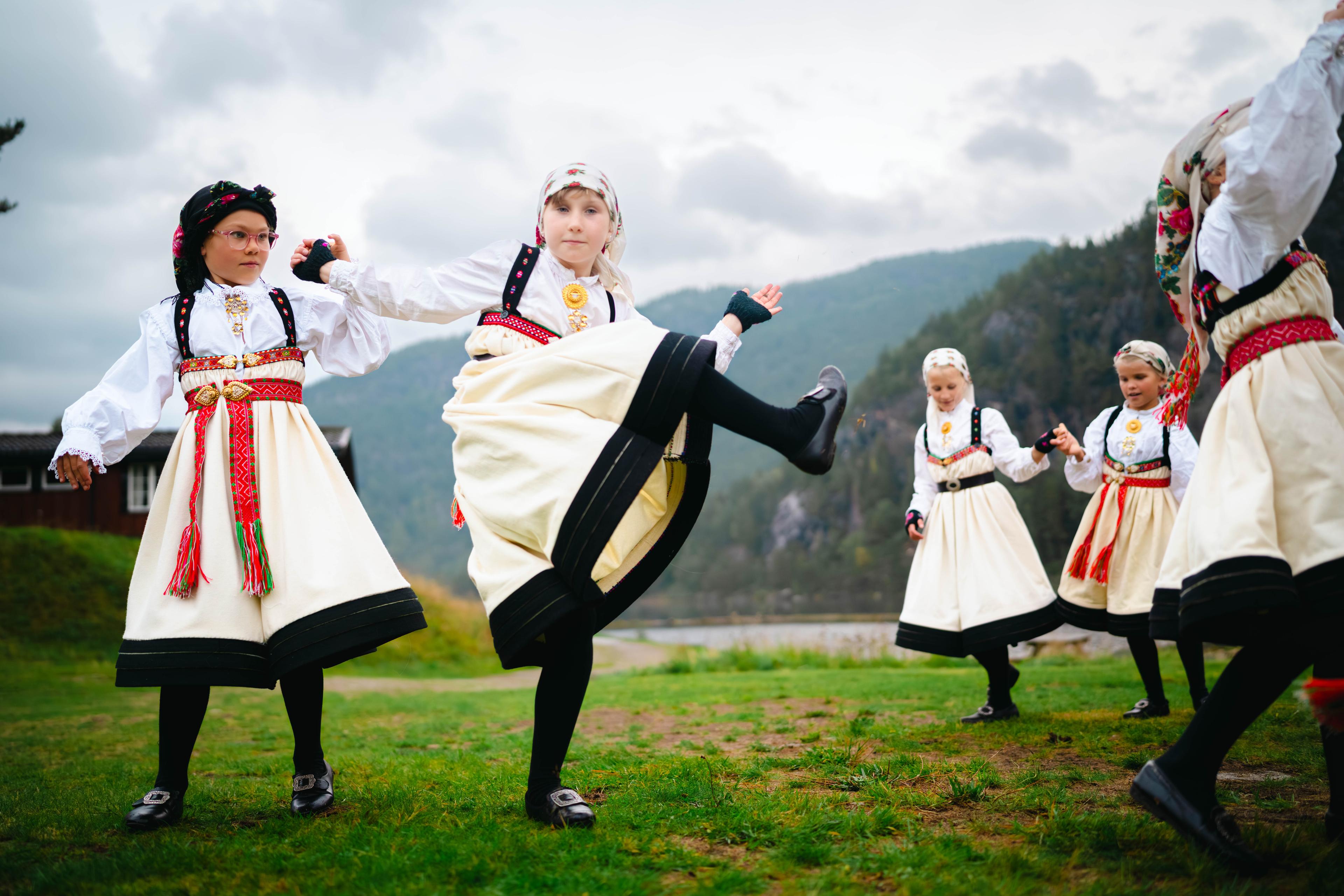 A group of young girls dancing "Setesdalsgangar", a traditional Norwegian folk dance from the Setesdal valley in Southern Norway.