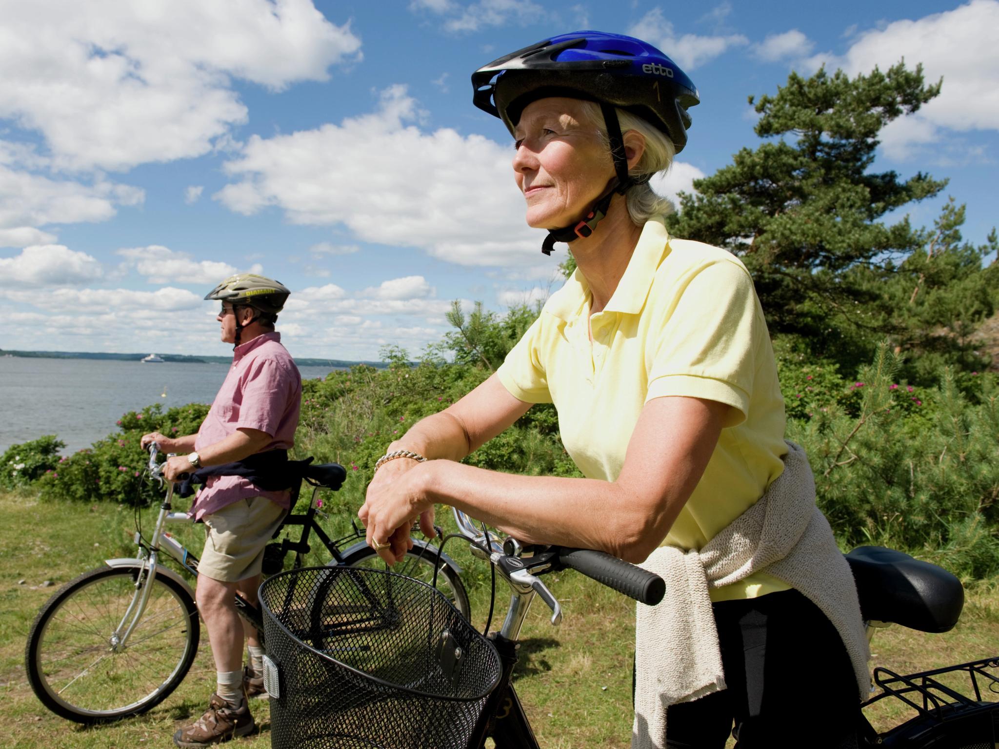 A couple resting with their bikes in Østfold, Eastern Norway