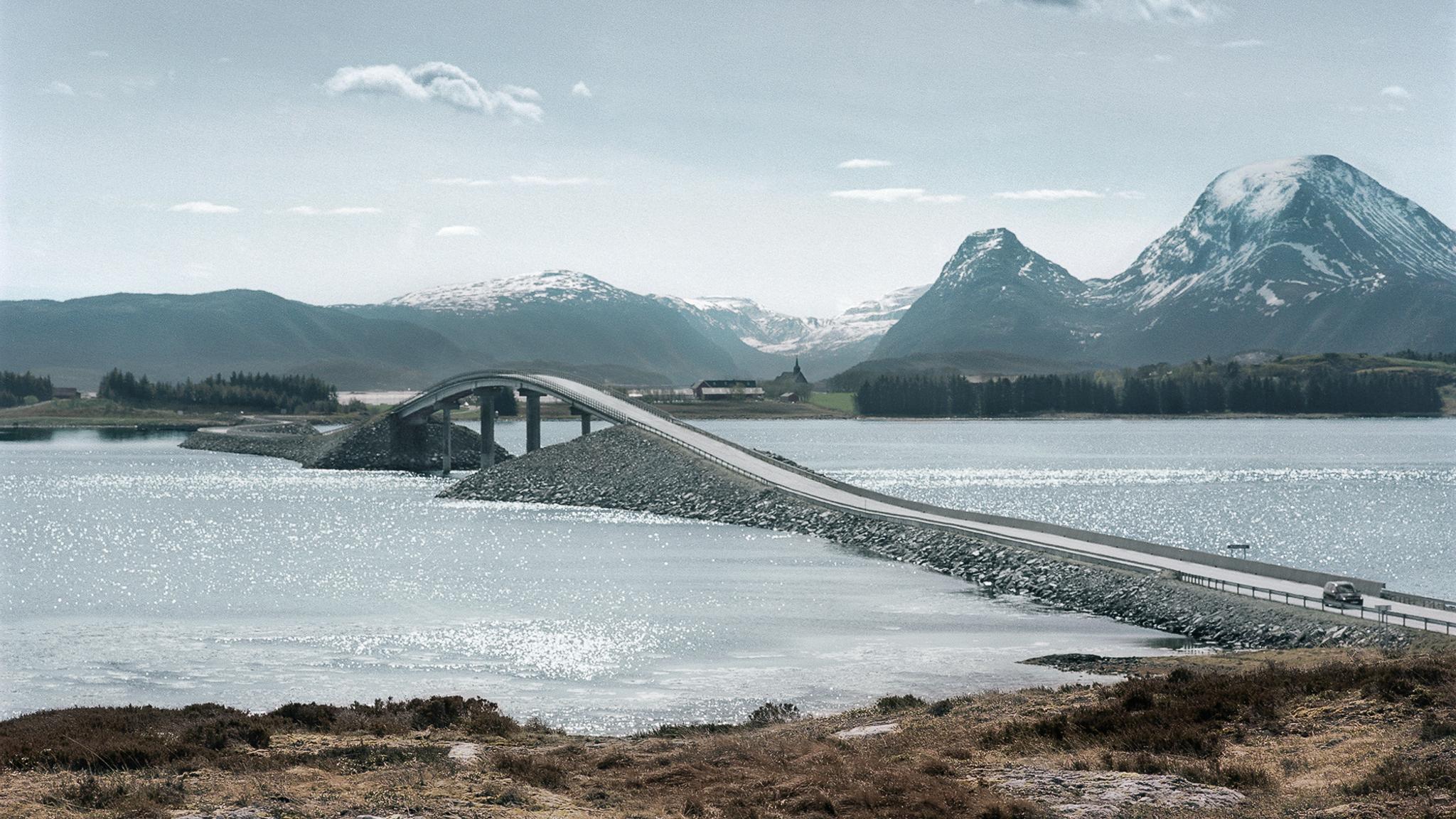 A bridge on the North Atlantic Road, Smøla in Fjord Norway. Mountains in the background.