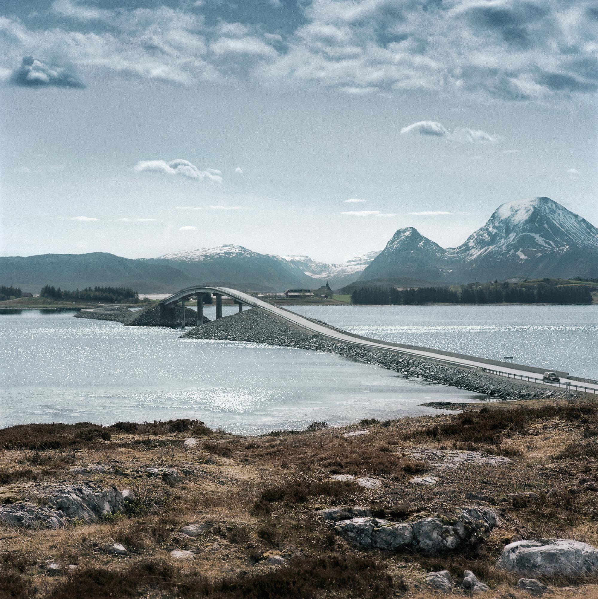 A bridge on the North Atlantic Road, Smøla in Fjord Norway. Mountains in the background.