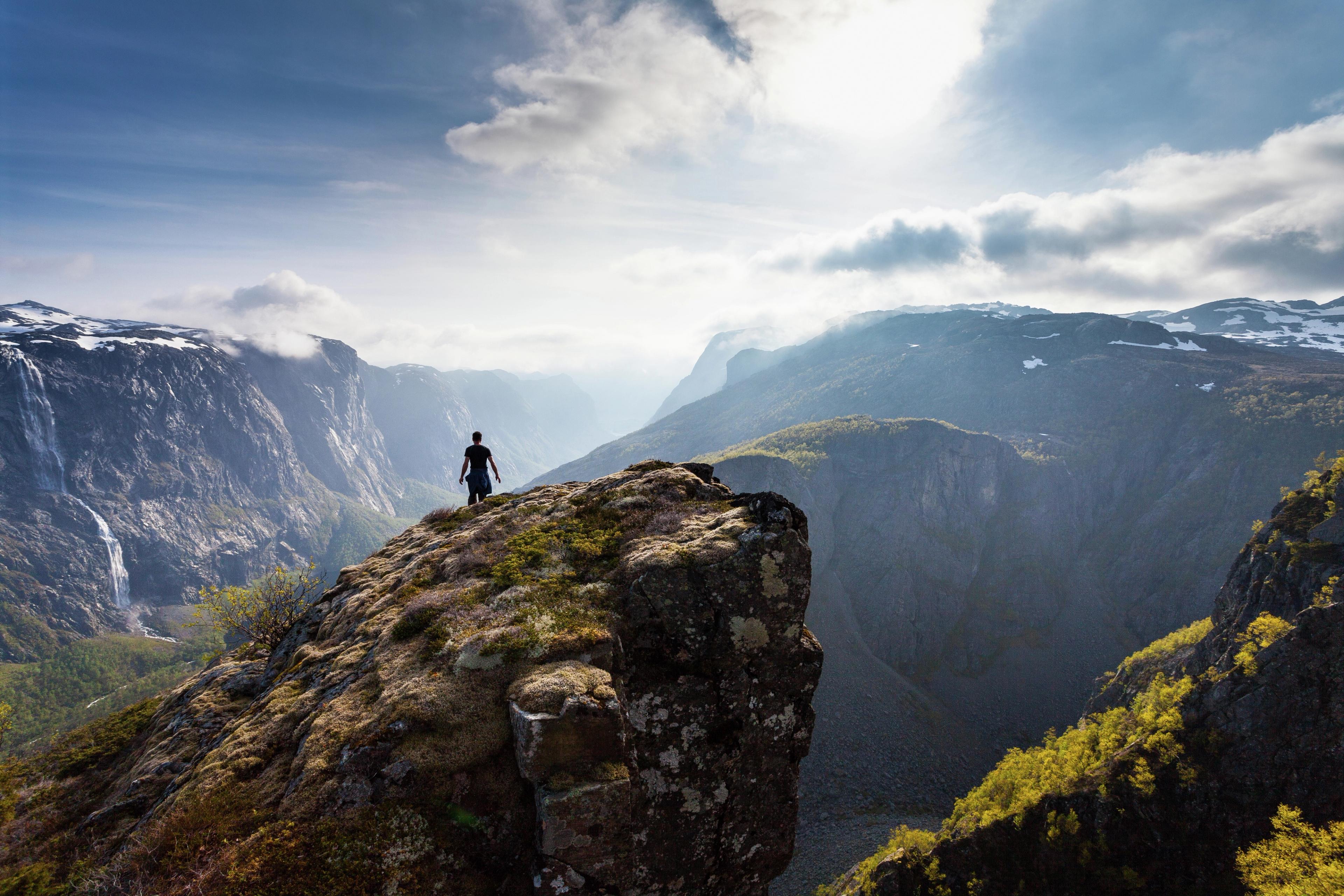Man hiking the mountain Fossdjuvet in Forsand, Fjord Norway