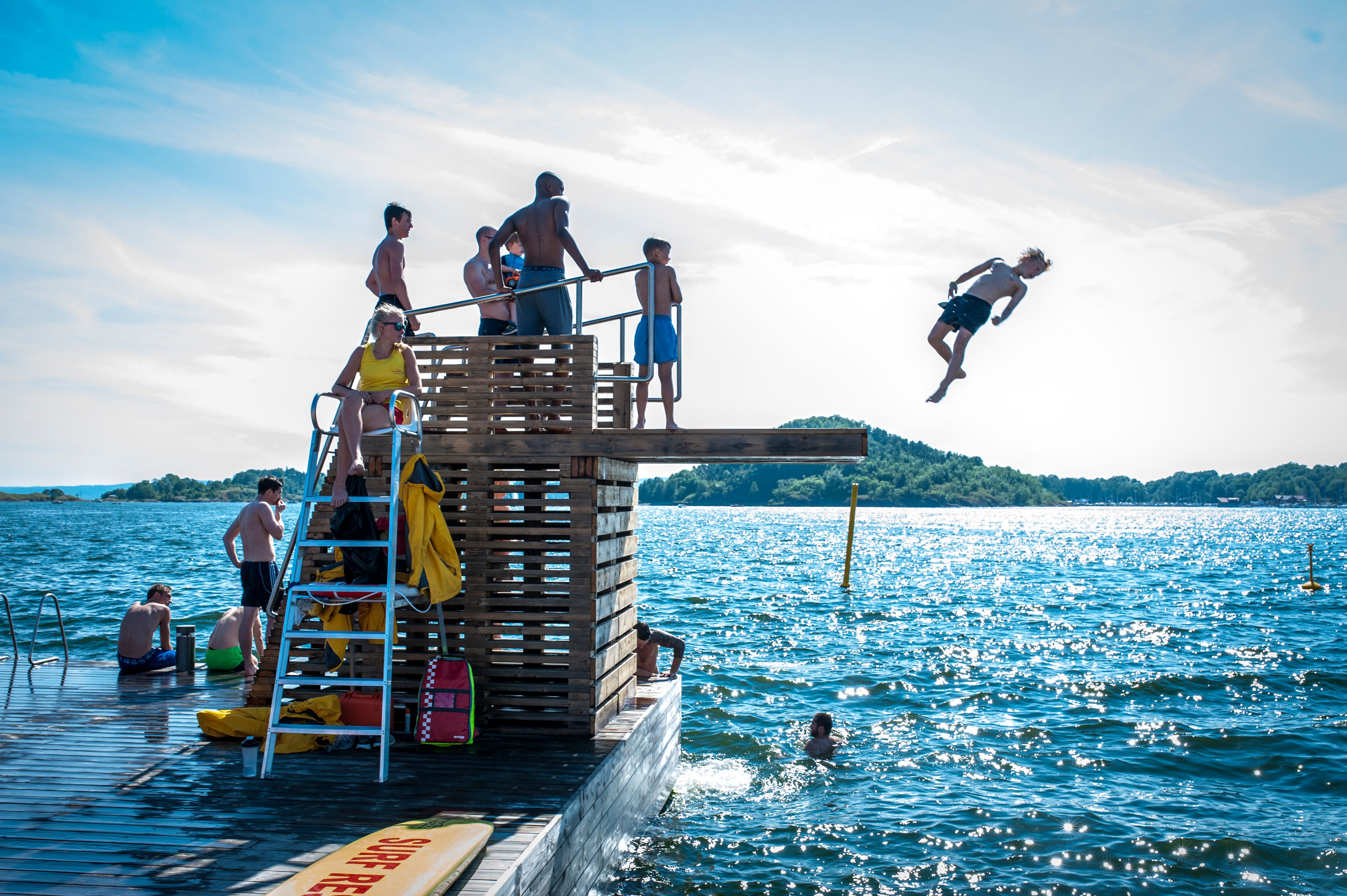 Boy making a dive into the Oslo fjord