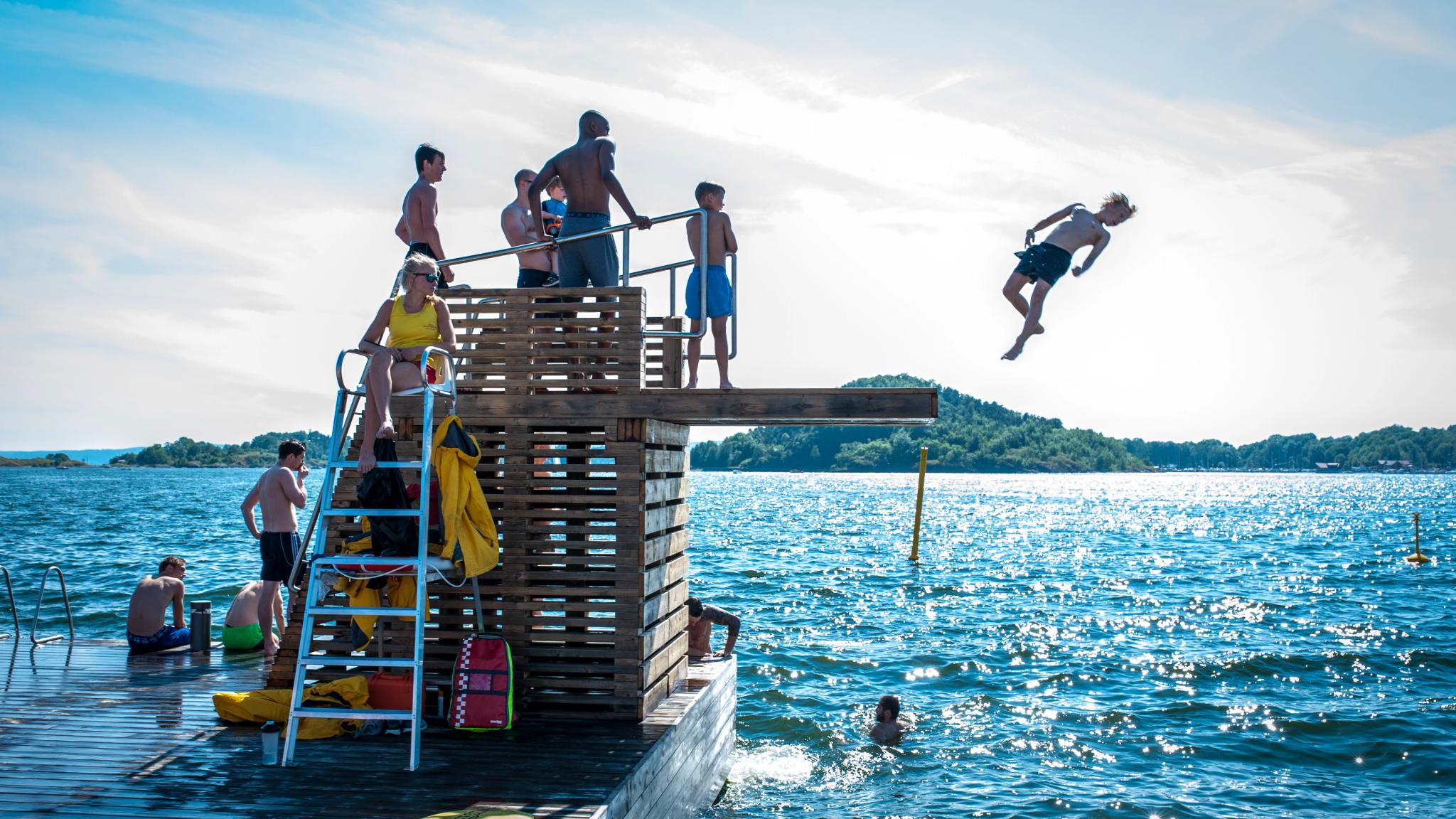 Boy making a dive into the Oslo fjord