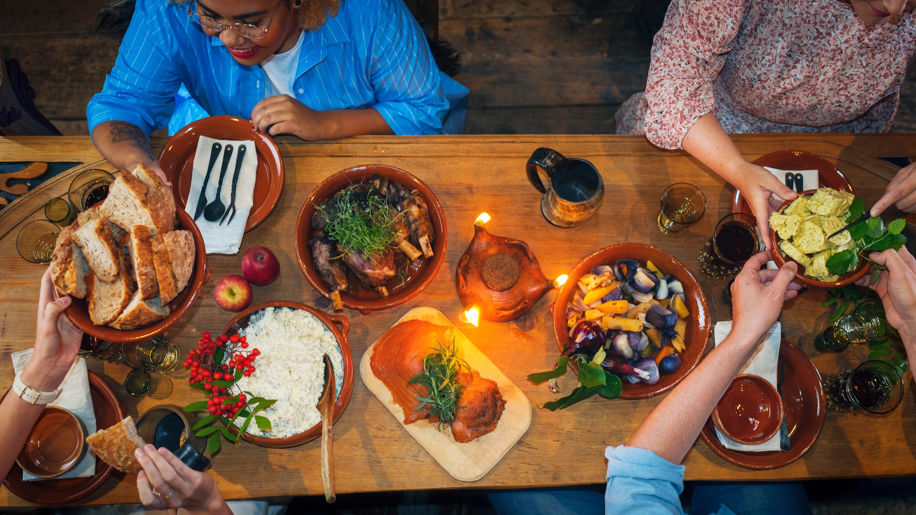 People enjoying local foods at Stiklestad