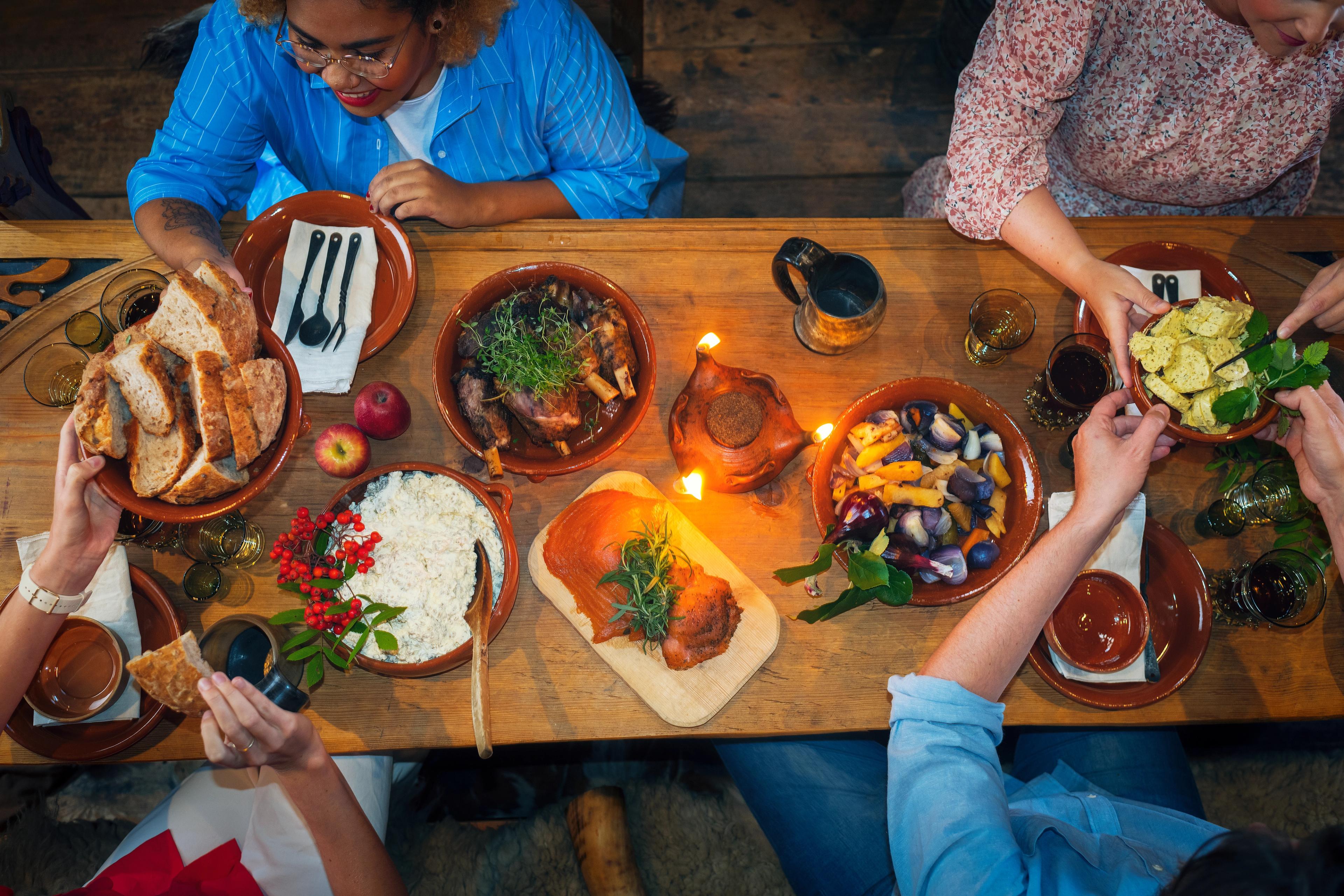 People enjoying local foods at Stiklestad