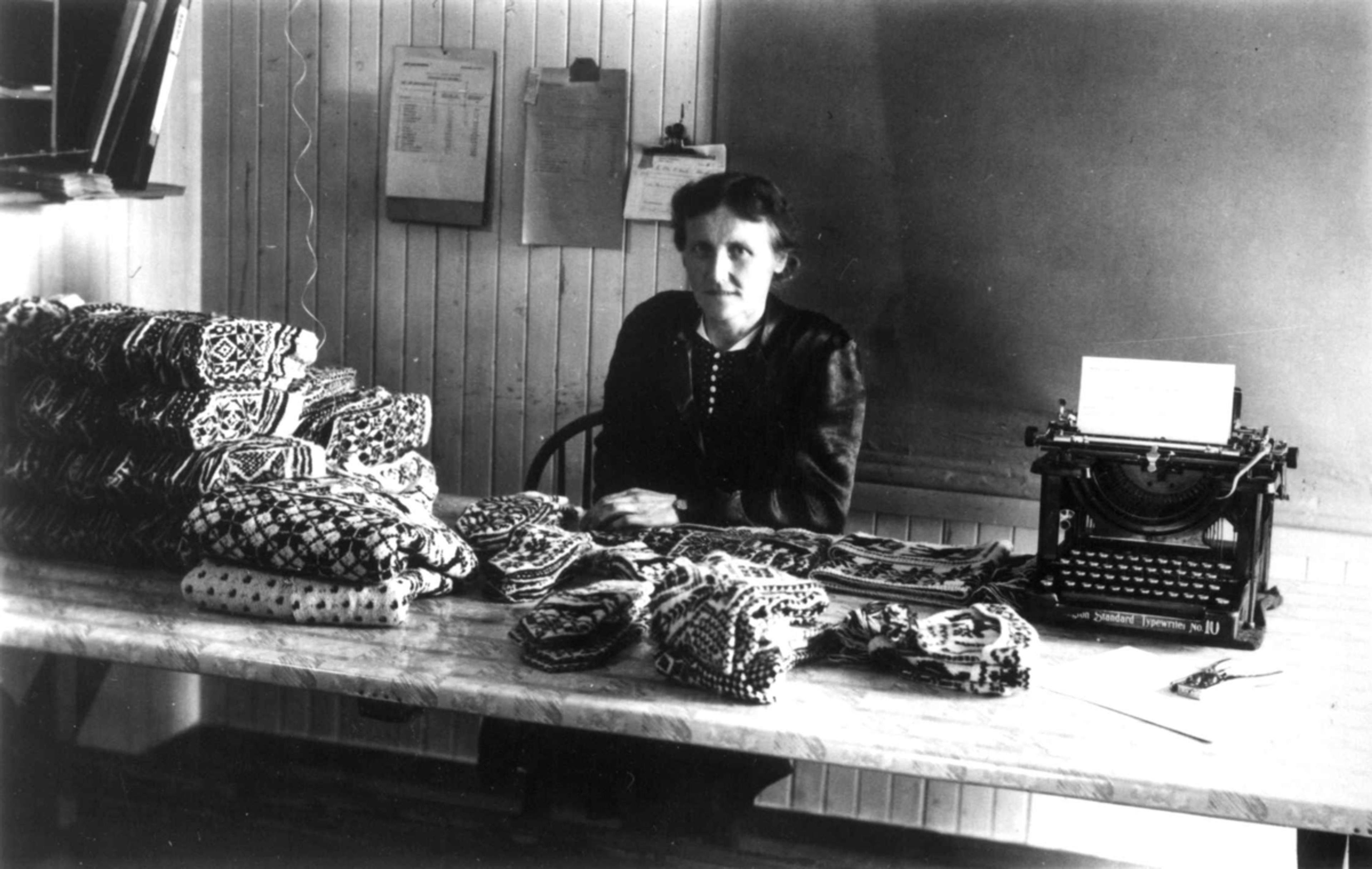 A woman controlling Selbu mittens at Selbu Husflidcentral, Trøndelag, Norway