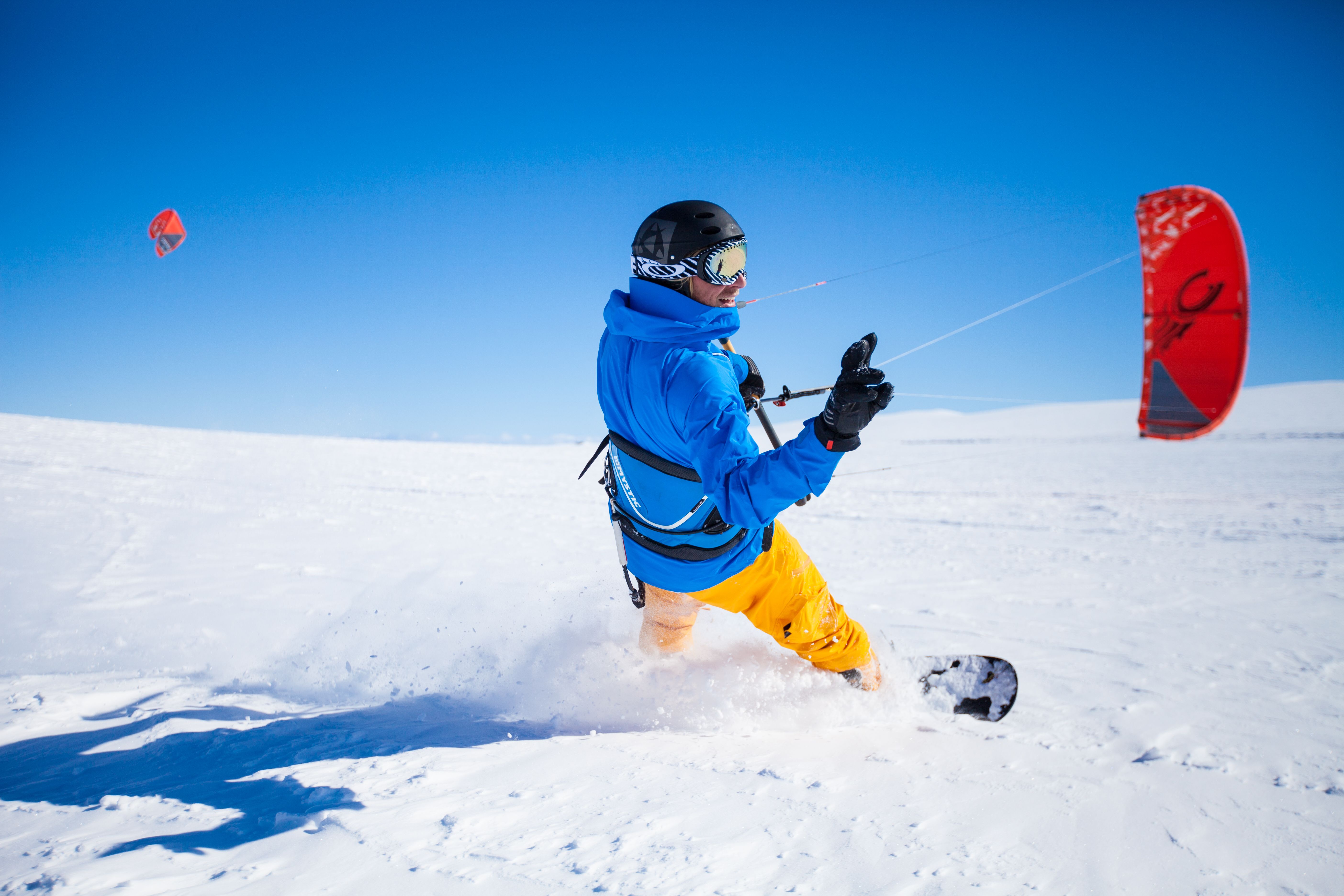 A person snow kiting on the Valdresflye mountain plateau in Valdres, Eastern Norway