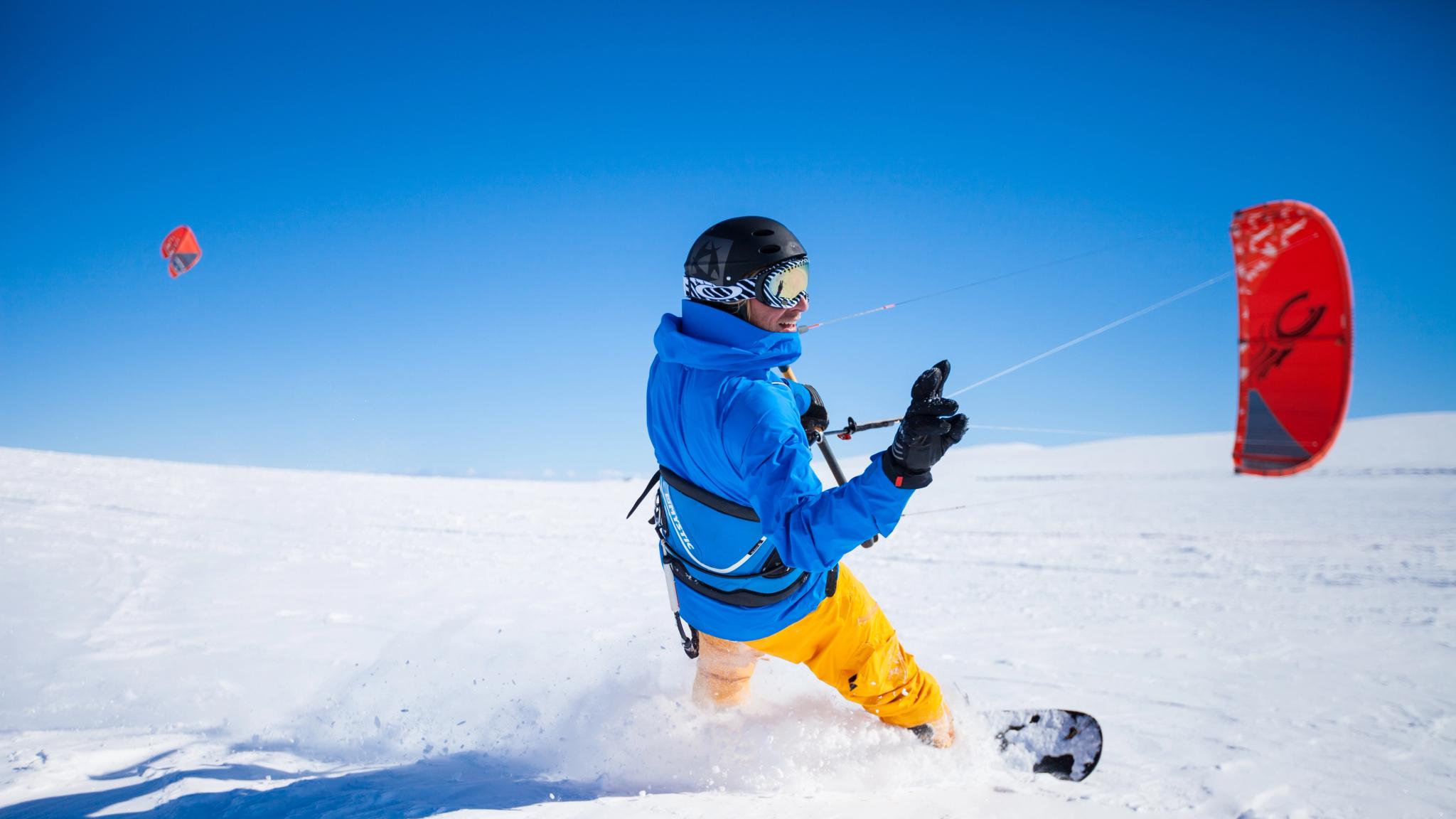 A person snow kiting on the Valdresflye mountain plateau in Valdres, Eastern Norway