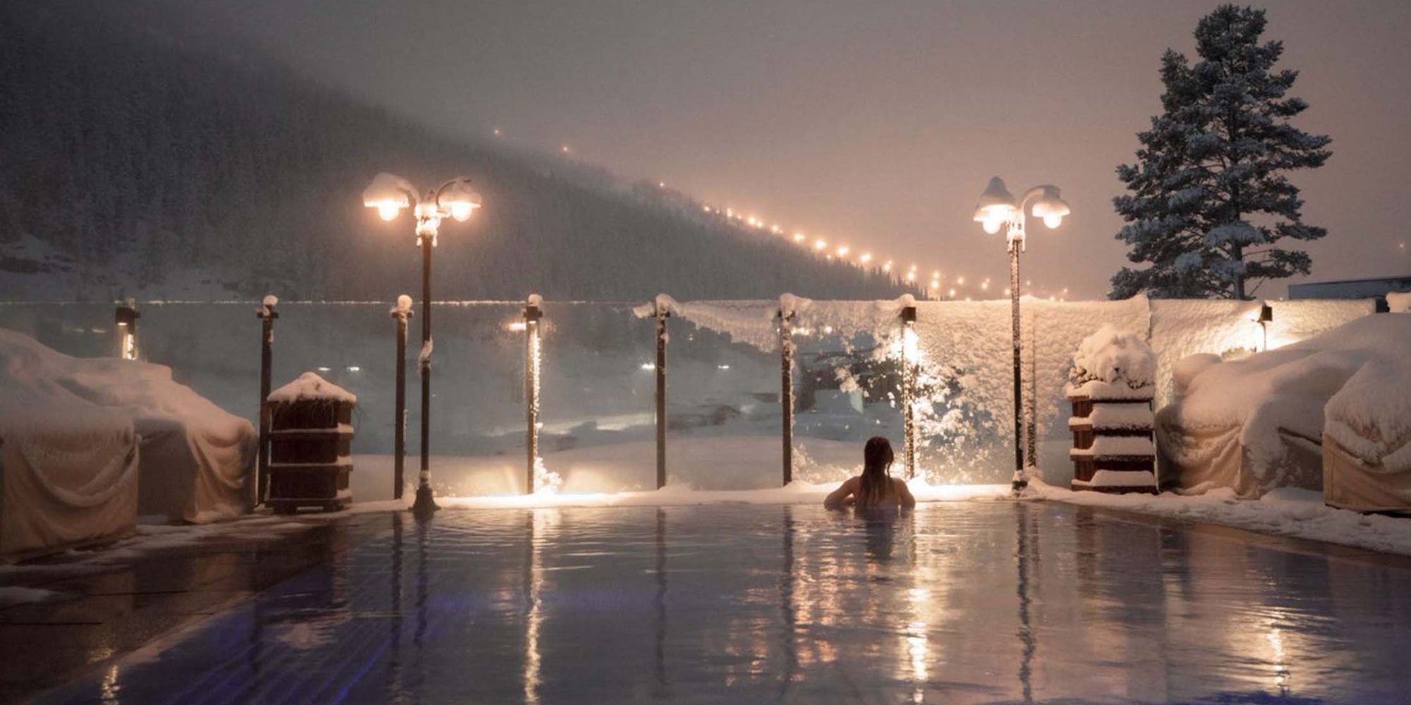 Woman enjoying view from a pool at Fyri resort, Hemsedal