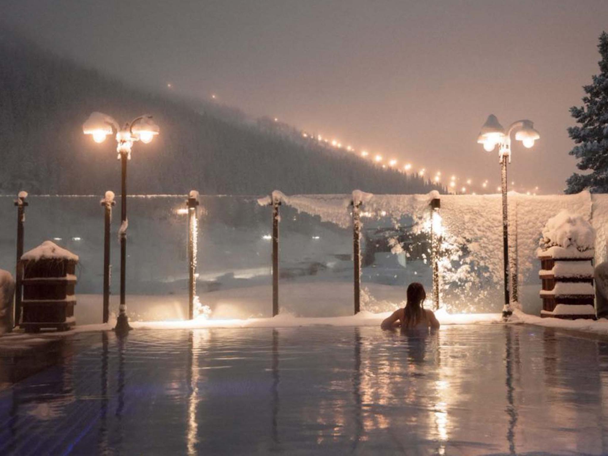 Woman enjoying view from a pool at Fyri resort, Hemsedal