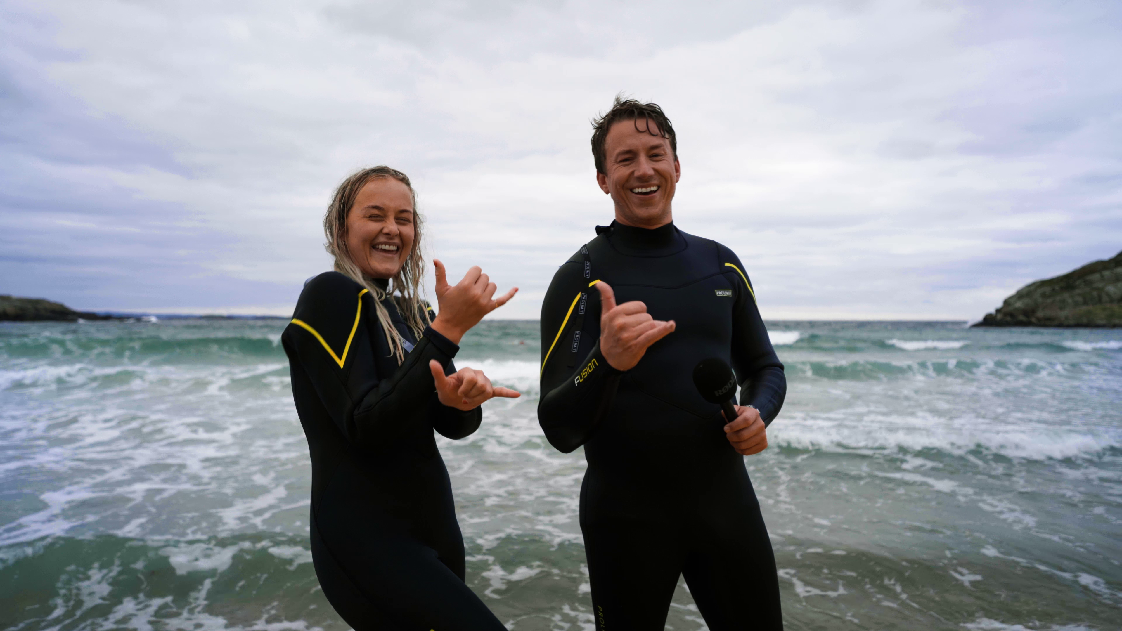 Two people in the water at the beach Lista in Southern Norway.