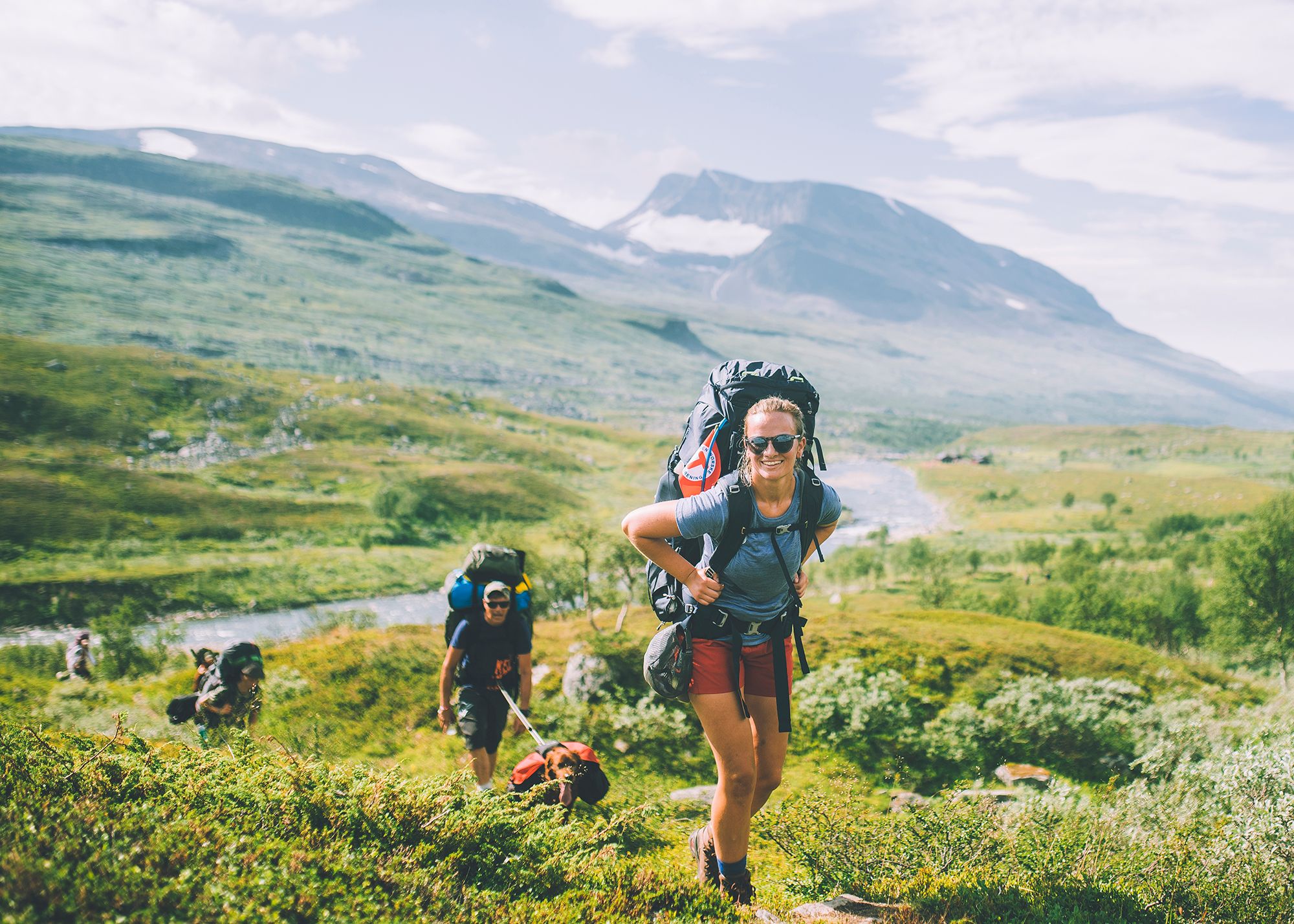 People summer hiking in mountainous landscape in Indre Troms, Northern Norway